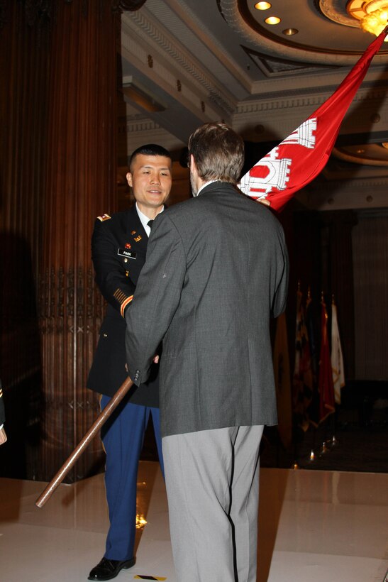Lt. Col. David C. Park (left) returns the colors to Deputy District Engineer Nate Barcom after assuming command of the USACE Philadelphia District during a July 12, 2019 ceremony in the Wanamaker Building.