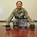 Senior Airman Savannah Perez’ three Airman of The Quarter Awards (left) and the JBSA Top Paralegal trophy (right) will grow by two soon. (Photo by Brian Lepley)
