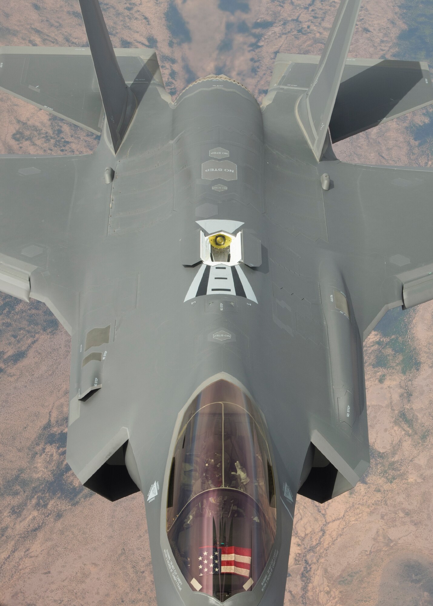 A Republic of Korea Air Force, F-35A Lightning II pilot waves after being refueled by a KC-135 Stratotanker, March 15, 2019, in Ariz. Aerial Refueling is the process in which on aircraft transfers fuel to another aircraft. This maneuver saves time and money by keeping jets from having to land mid-mission. (U.S. Air Force photo by Airman 1st Class Leala Marquez)