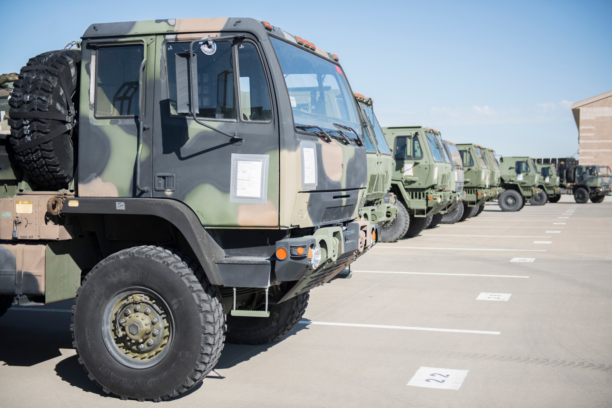 Medium Tactical Vehicles line up in preparation for a 726th Air Control Squadron exercise July 11, 2019, at Mountain Home Air Force Base, Idaho. The vehicles are parked ready to leave from MHAFB in a convoy during the exercise. (U.S Air Force Photo by Senior Airman Tyrell Hall)