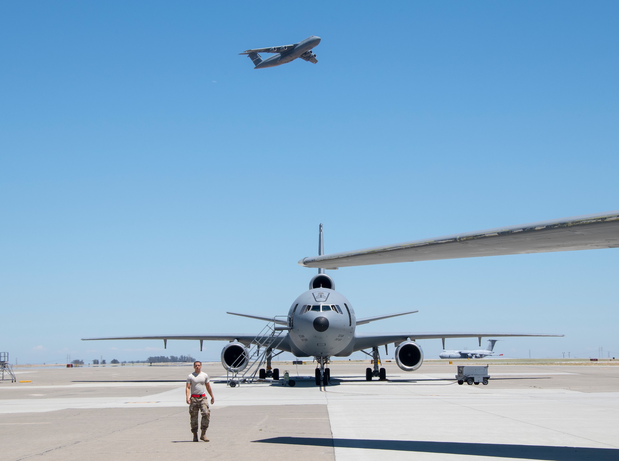 U.S. Air Force flying crew chiefs assigned to the 660th Aircraft Maintenance Squadron, prepare KC-10 Extender aircraft prior to takeoff July 11, 2019, at Travis Air Force Base, California. FCCs are responsible for a wide variety of maintenance duties while traveling with the aircraft to including refueling, paperwork, routine maintenance and troubleshooting major issues. (U.S. Air Force photo by Heide Couch)