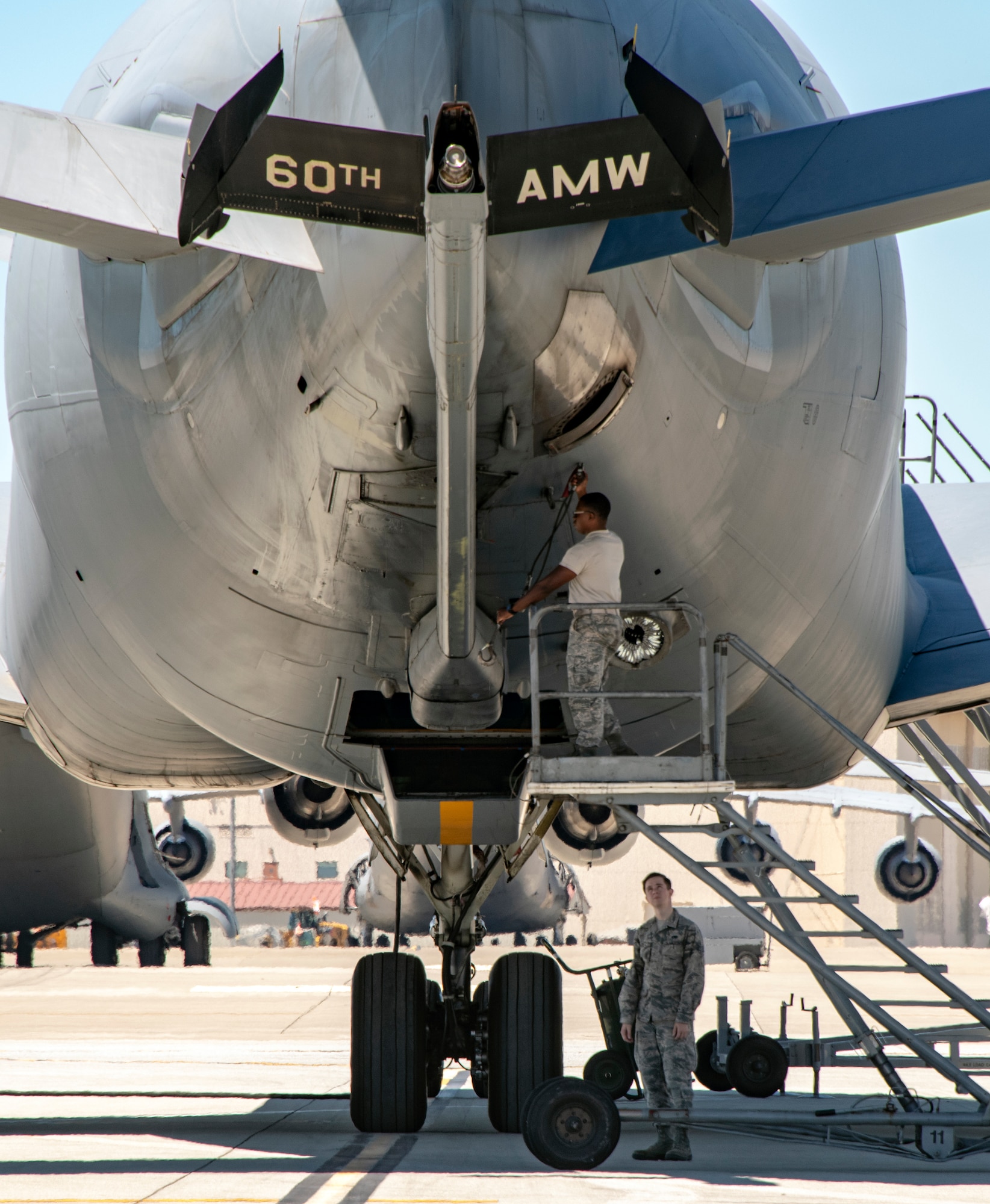 U.S. Air Force Airmen assigned to the 660th Aircraft Maintenance Squadron, work on the boom of a KC-10 Extender July 11, 2019, at Travis Air Force Base, California. The 660th AMXS provides combat-ready maintenance personnel and organizational support to inspect, service, and repair all transit and assigned KC-10A aircraft. (U.S. Air Force photo by Heide Couch)