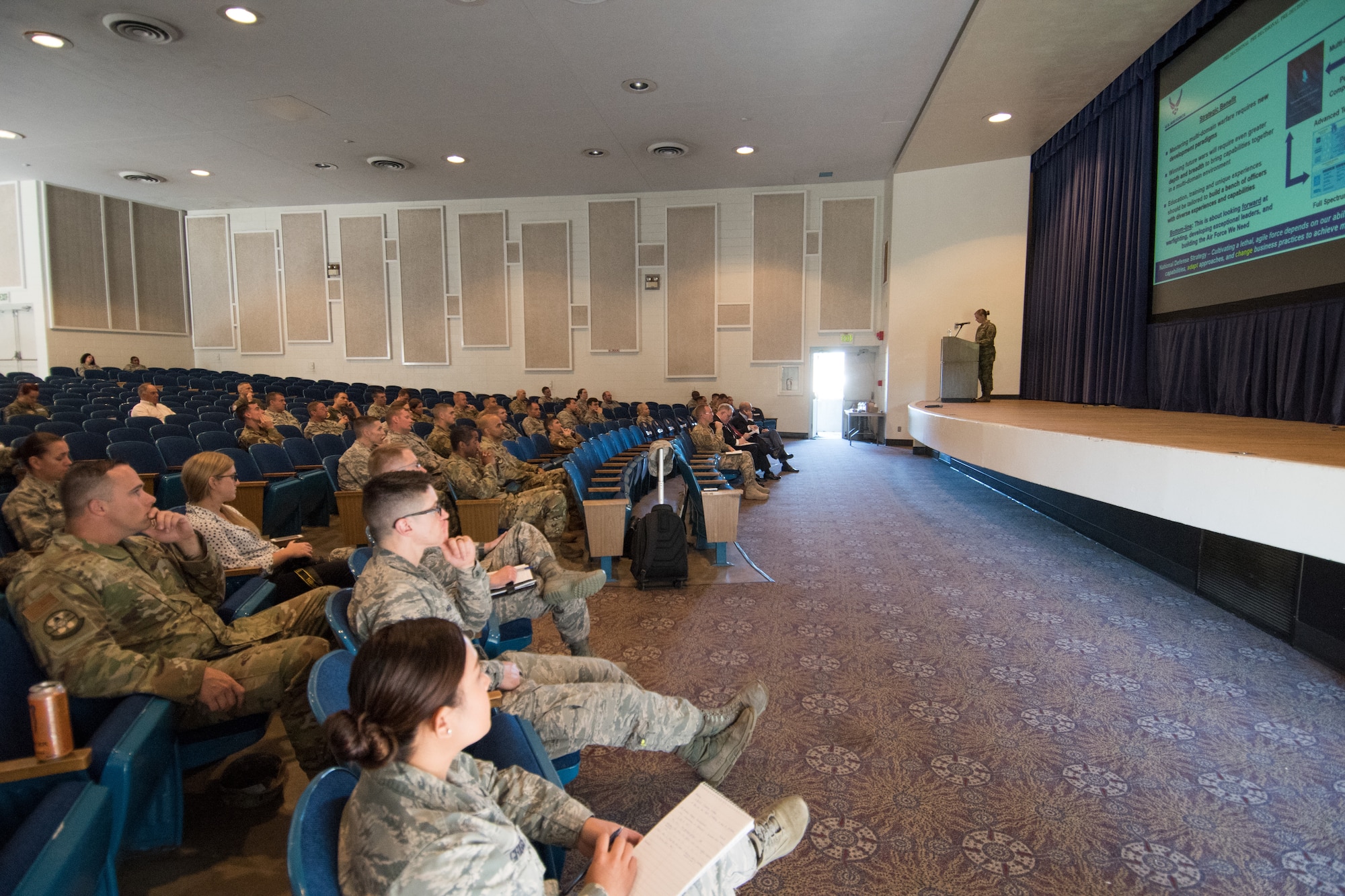 Airmen listen to the Line of the Air Force Promotion Category Configuration brief during the Assistant Secretary of the Air Force Manpower and Reserve Affairs team visit to Peterson Air Force Base, Colorado, July 9, 2019. Airmen are encouraged to either attend one of the SAF/MR visits at their respective base or go online for more information: https://mypers.af.mil/app/answers/detail/a_id/43326.