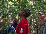 DEDEDO Guam (July 12, 2019) - Guam Sens. Sabina Perez, left, and Clynton Ridgell, center, view the endangered Serianthes nelsonii tree during a site visit at Northwest Field in Dededo July 12. At the request of Sen. Tina Muna Barnes, speaker of the 35th Guam Legislature, Rear Adm. Shoshana Chatfield, commander, Joint Region Marianas and a team of Navy and Marine Corps environmental professionals led a senatorial visit to the site of the 
endangered Serianthes nelsonii tree at Northwest Field.  The group received a briefing from Marine Corps Activity Guam (MCAG) Environmental Director Al Borja and MCAG Natural Resources Specialist Lauren Gutierrez, and saw 
firsthand the military's commitment to environmental stewardship in the 
preservation of the island's ecosystem.