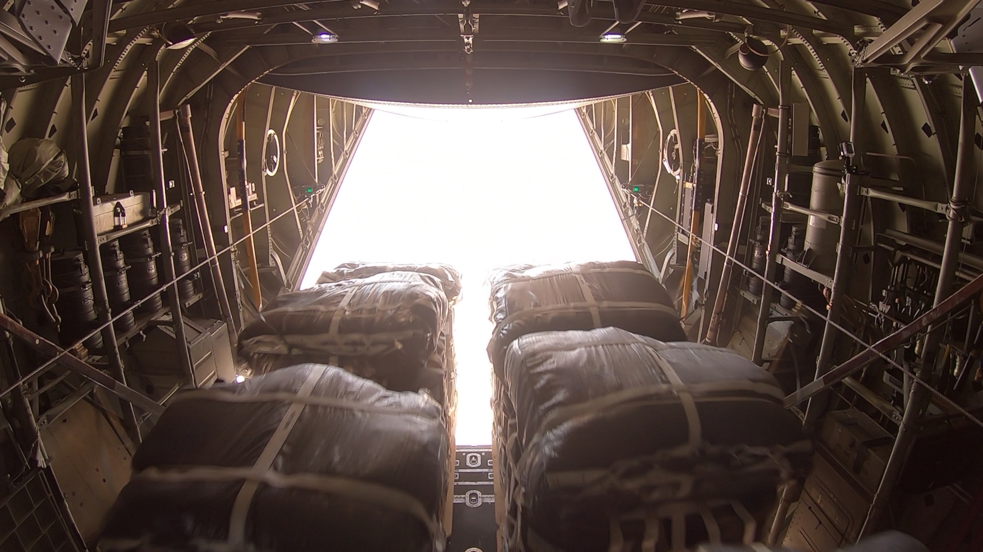 Airmen of the 746th and 816th Expeditionary Airlift Squadrons conduct the largest sustainment airdrop in the area of responsibility’s history July 11, 2019. An airdrop is a delivery method used to provide vital supplies to service members in remote or combat locations. (U.S. Air Force photo)