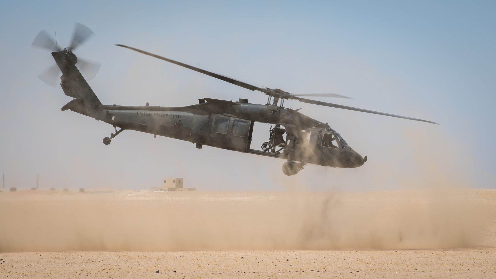 A U.S. Army UH-60 Blackhawk medical evacuation helicopter makes a landing during a training scenario at Camp Buehring, Kuwait, July 12, 2019. Airmen with the 386th Expeditionary Medical Group from Ali Al Salem Air Base, Kuwait, trained with Tactical Air Control Support (TACP) Specialist Airmen assigned to the 820th Expeditionary Air Support Operations Squadron, Camp Buehring,Kuwait, for medevac training. (U.S. Air Force photo by Tech. Sgt. Daniel Martinez)