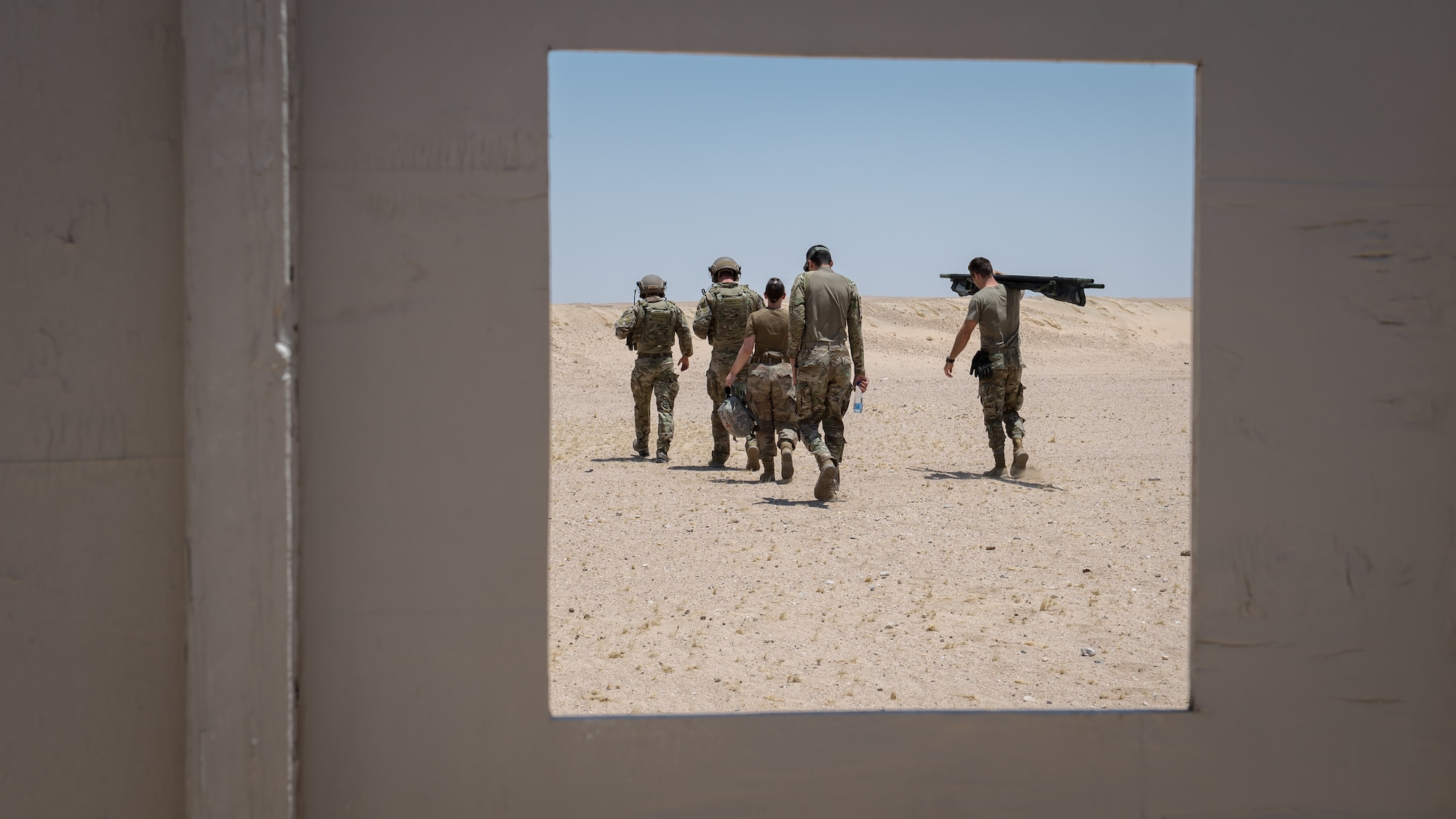 Tactical Air Control Support (TACP) Airmen with the 820th Expeditionary Air Support Operations Squadron, prepare to exericse a medical evacuation scenario with Airmen from the 386th Expeditionary Medical Group while training at Camp Buehring, Kuwait, July 12, 2019. Medical and TACP Airmen trained together to hone their skills and become more efficient at treating injuries and coordinating medevac efforts for casualties. (U.S. Air Force photo by Tech. Sgt. Daniel Martinez)