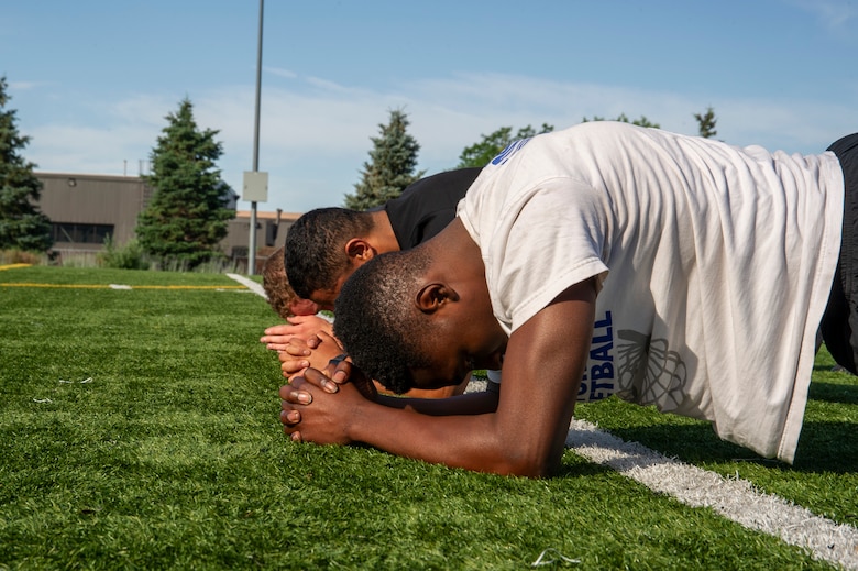Trainees from the 302nd Airlift Wing Development and Training Flight participate in group exercise July 14, 2019 at Peterson Air Force Base, Colorado. The D&TF program is designed to prepare future Reserve Airmen for Air Force basic military training. (U.S. Air Force photo by Tech. Sgt. Amber Sorsek)