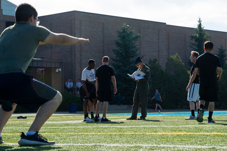 Tech. Sgt. Joshua Winn, 302nd Airlift Wing Development and Training Flight program manager, supervises trainees during group physical fitness training July 14, 2019 at Peterson Air Force Base, Colorado. The D&TF program is designed to prepare future Reserve Citizen Airmen for Air Force basic military training. (U.S. Air Force photo by Tech. Sgt. Amber Sorsek)