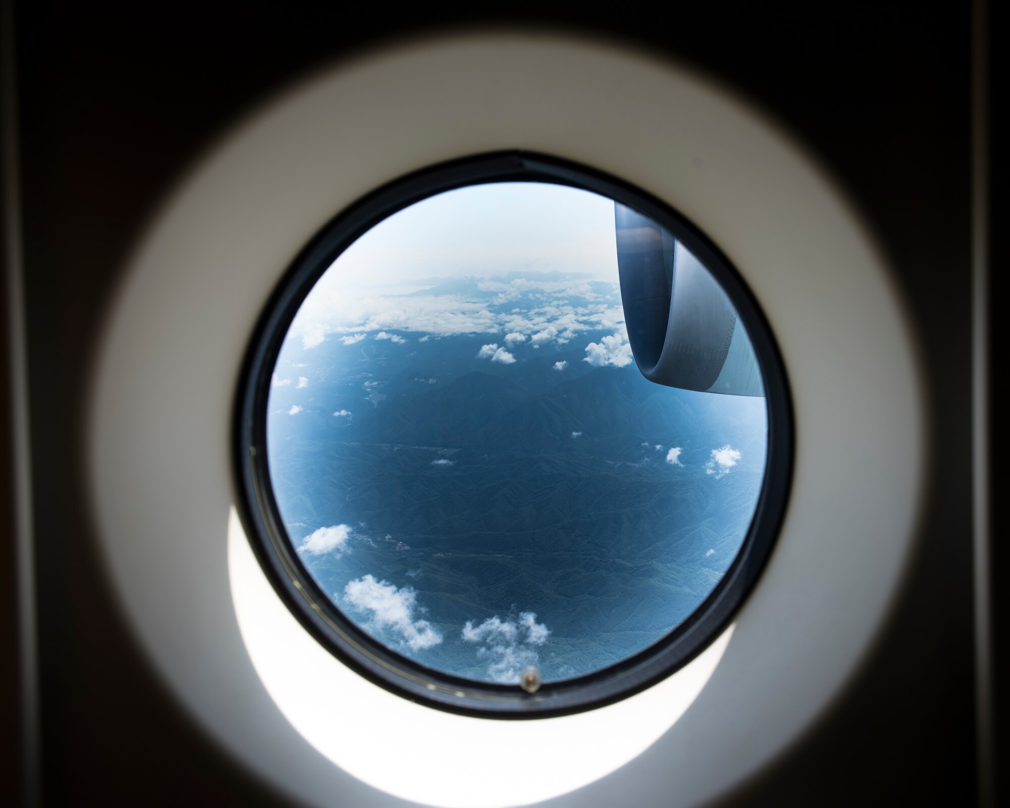 A view from a window of a C-2 assigned to Japan Air Self-Defense Force, 3rd Tactical Airlift Wing, 403rd Squadron during a bilateral airlift exchange over Chubu region, Japan, July 10, 2019.
