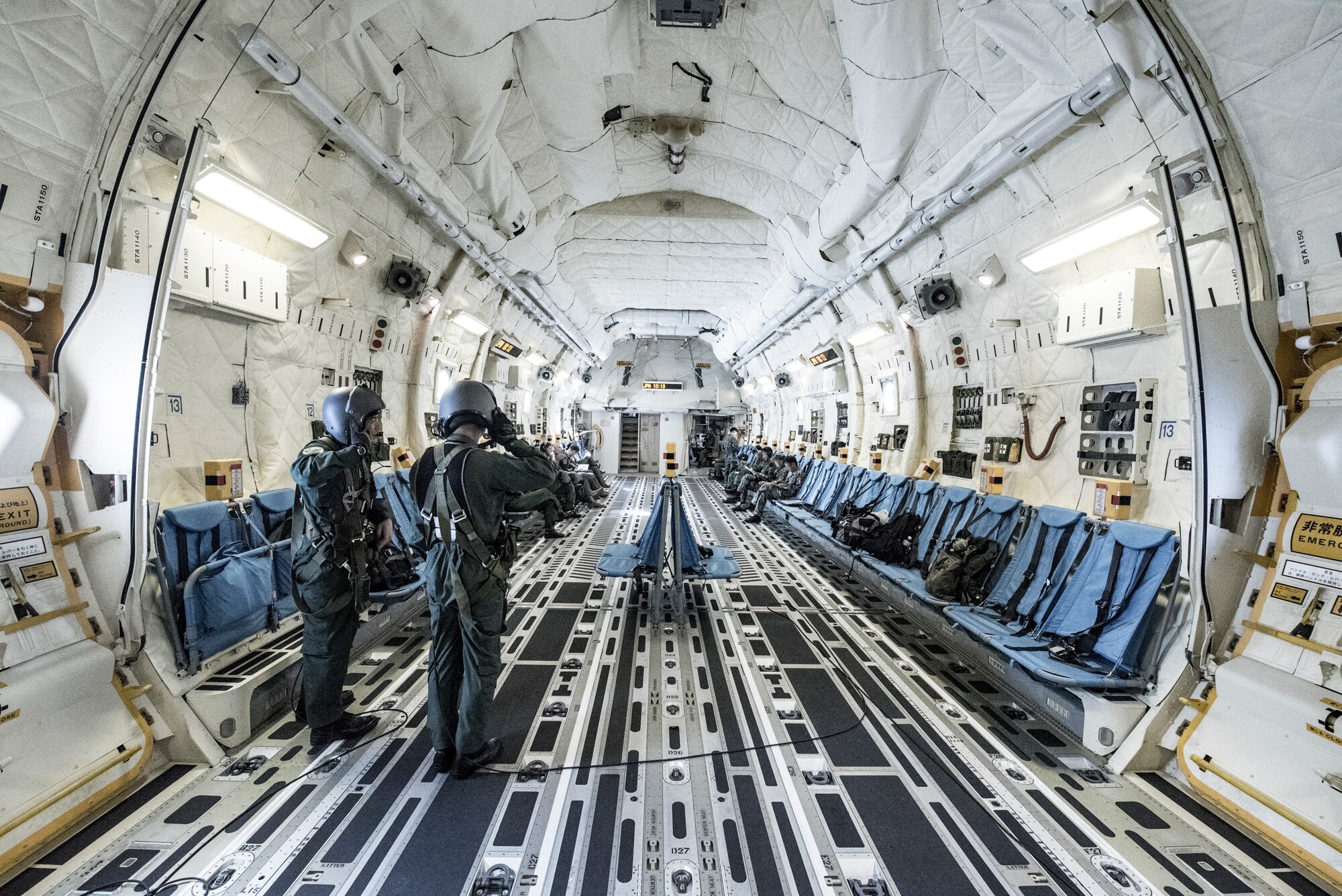 Members from the Japan Air Self-Defense Force put on their helmets during a bilateral airlift exchange over Chubu region, Japan, July 10, 2019.