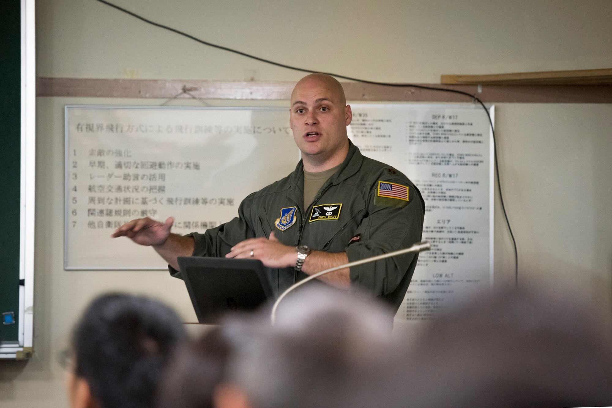 Major Christopher Wolff, 36th Airlift Squadron assistant director of operations, briefs members of the Japan Air Self-Defense Force during a bilateral airlift exchange at Iruma Air Base, Japan, July 10, 2019.