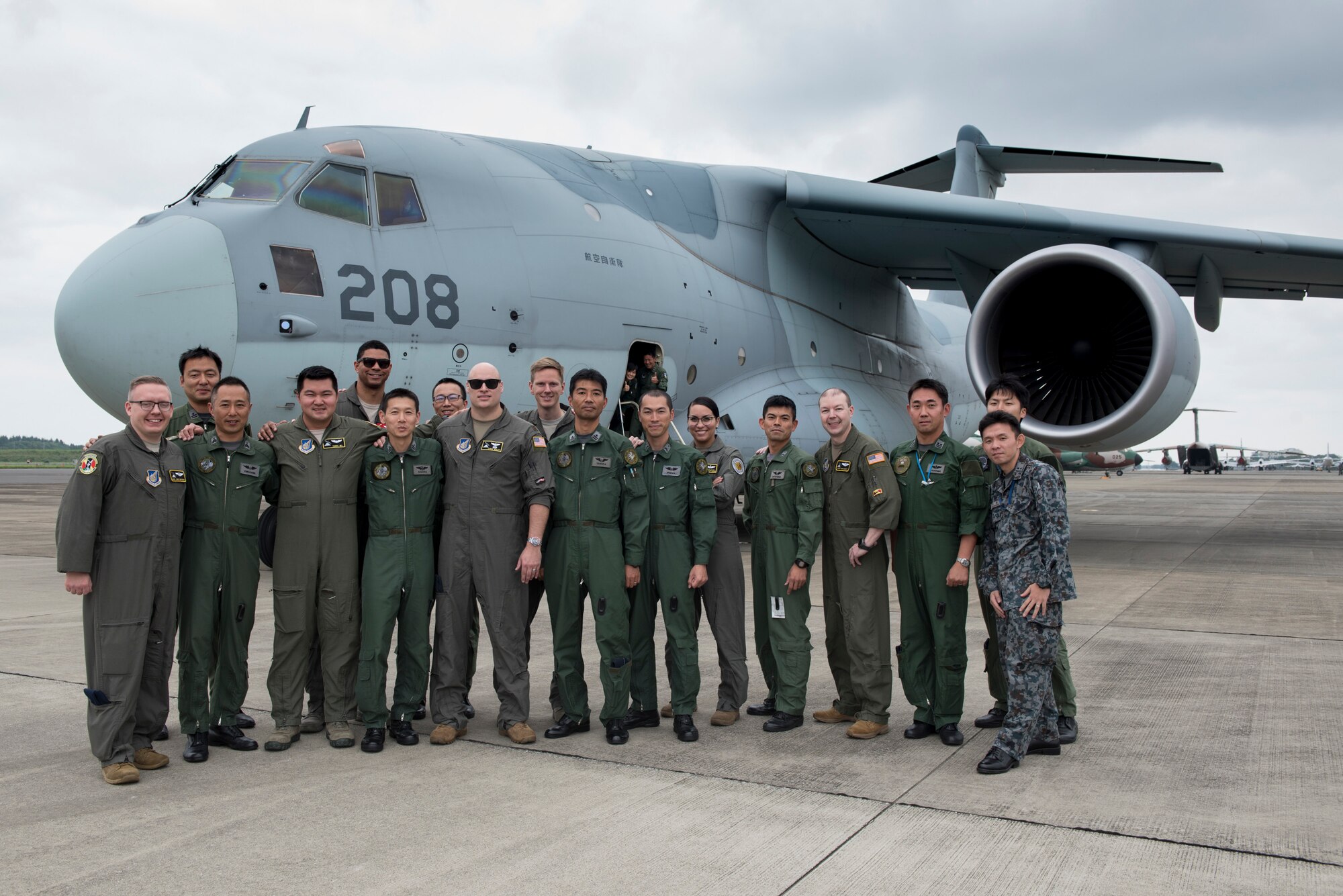U.S. Air Force and Japan Air Self-Defense Force members pose for a photo after landing at Iruma Air Base, Japan, July 10, 2019.