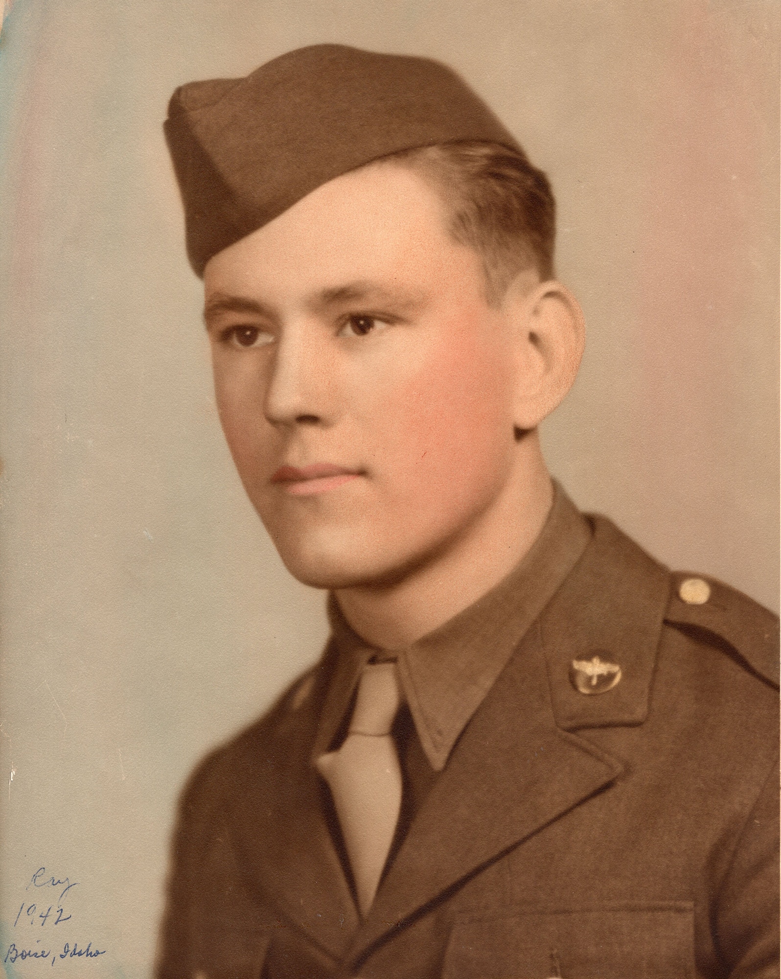 Dewey Christopher, now a retired master sergeant and veteran of World War II and the 100th Bombardment Group and 351st Bomb Squadron, poses for his official photo in his Class A uniform in 1942. Christopher was a crew chief with the 100th Bombardment Group and 351st Bomb Squadron at Thorpe Abbotts, Diss, England, during World War II. He visited RAF Mildenhall in June 2019, when the Professional Development Center was renamed in his honor, and while here shared stories from his military days. (Courtesy photo)