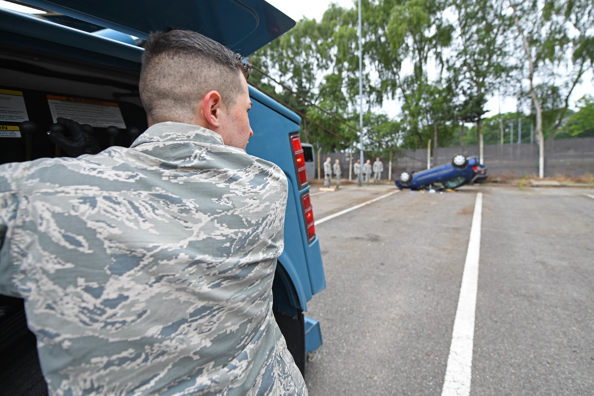 U.S. Air Force Airman 1st Class Louis Goscha, 48th Logistics Readiness Squadron ground transportation operator, flips a car using a tow truck during a Readiness Honed In Operations training day at RAF Lakenheath, England, July 13, 2019. The training was the first dual-wing RHINO training day for ground transportation Airmen that encompassed expeditionary, contingency and specialty skills training such as basic expeditionary airfield resources base setup, integrated defense and vehicle recovery. (U.S. Air Force photo by Senior Airman Luke Milano)