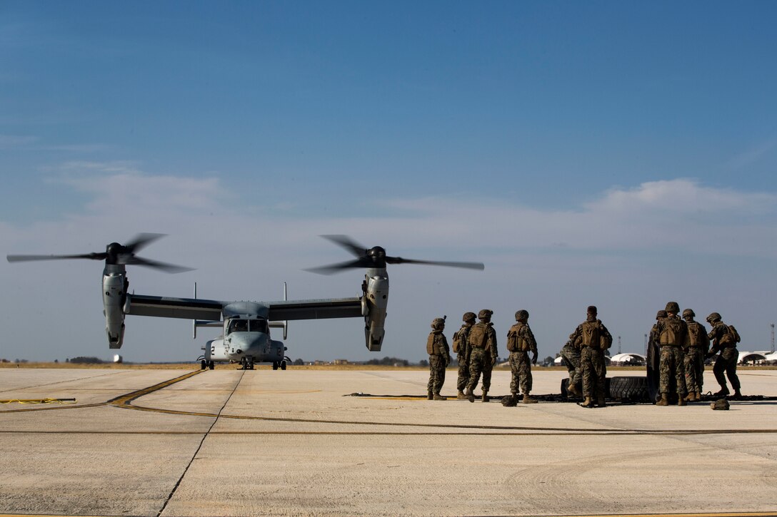 U.S. Marines with Special Purpose Marine Air-Ground Task Force-Crisis Response-Africa 19.2, Marine Forces Europe and Africa, prepare cargo during helicopter support team training with a U.S. Marine Corps MV-22B Osprey on Moron Air Base, Spain, July 9, 2019