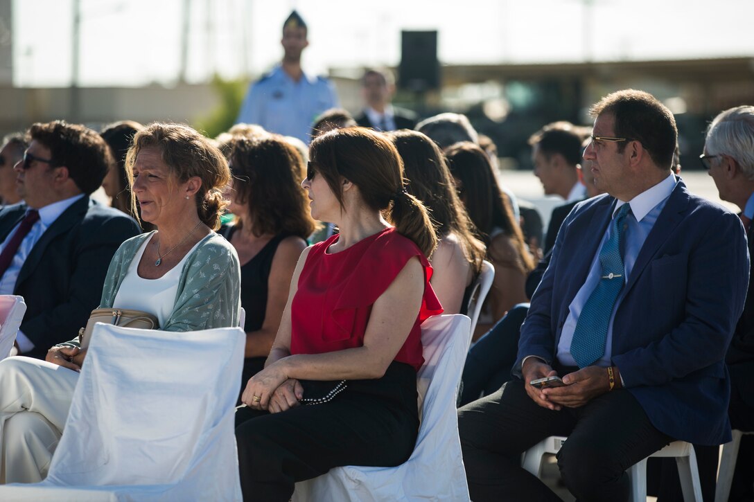 Friends and family observe a change of command ceremony between Spanish Col. Carlos Perez Martinez, the off-going base commander, and Spanish Col. D. Rafael Saiz Quevado, the on-coming base commander, at Moron Air Base, Spain, July 5, 2019. Perez Martinez was the commander of Moron Air Base since 2017 and worked closely with multiple iterations of Special Purpose Marine Air-Ground Task Force-Crisis Response-Africa, Marine Forces Europe and Africa. SPMAGTF-CR-AF 19.2 is deployed to conduct crisis-response and theater-security operations in Africa and promote regional stability by conducting military-to-military training exercises throughout Europe and Africa. (U.S. Marine Corps photo by Cpl. Margaret Gale)