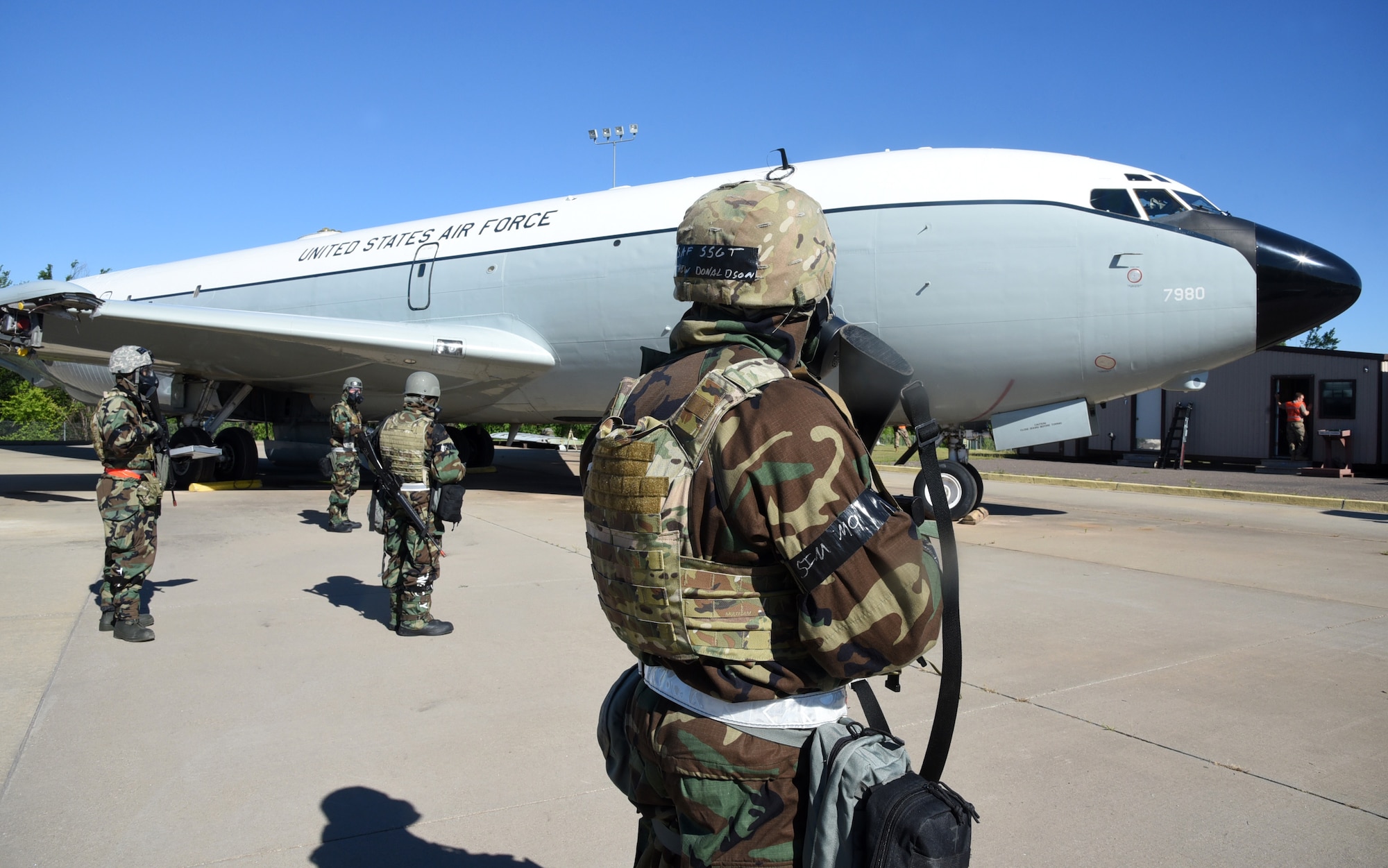 Members of the Expeditionary Depot Maintenance section perform post-attack reconnaissance sweeps during their chemical biological radiological nuclear and explosive exercise June 24. During the exercise, the Airmen are also required to perform aircraft battle damage repair. This was the first exercise for them to perform repairs to the newly damaged Speckled Trout, a KC-135 they received in April.