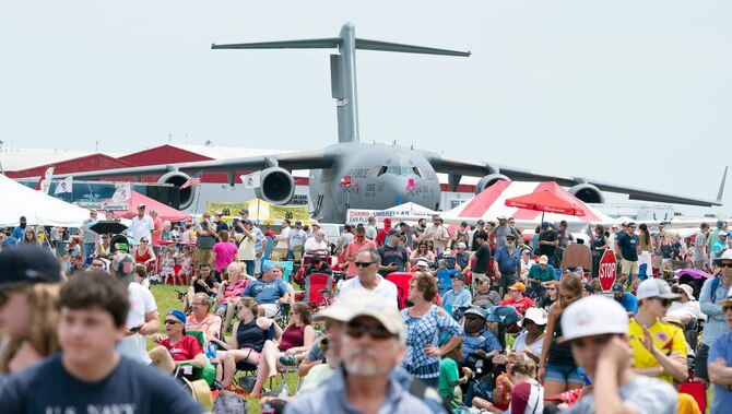 A U.S. Air Force C-17 Globemaster III cargo plane belonging to the 445th Airlift Wing serves as a backdrop to some of the thousands of spectators waiting for a chance to see the USAF Air Demonstration Squadron "Thunderbirds" fly June 23, 2019, at the Vectren Dayton Air Show. The 445th AW is an Air Force Reserve wing stationed at the nearby Wright-Patterson Air Force Base, Ohio.