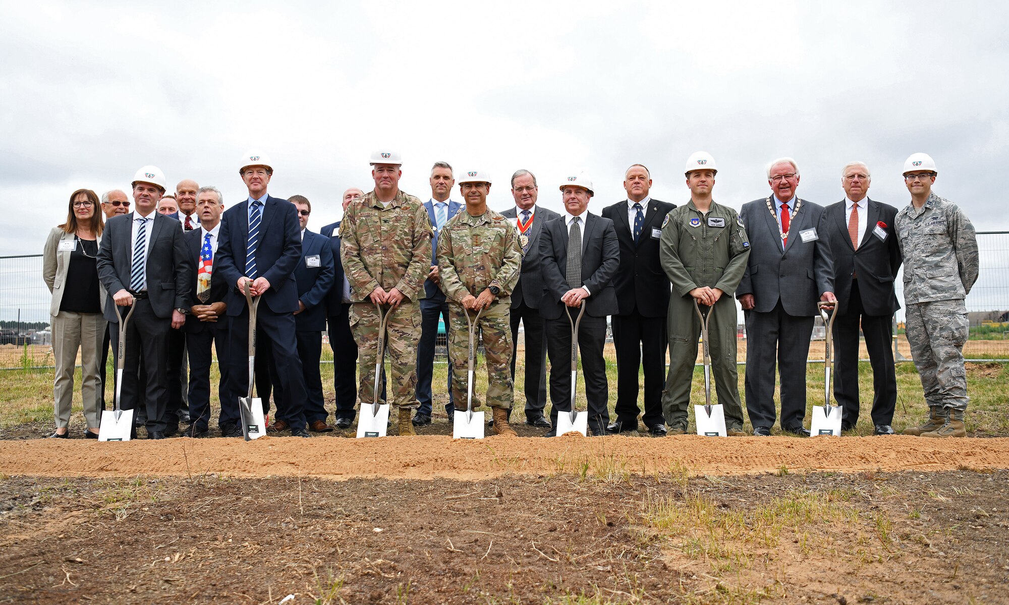 General Jeffrey L. Harrigian, U.S. Air Forces in Europe and Air Forces Africa commander, (center), poses for a photo with 48th Fighter Wing personnel and local civic leaders, partners and contractors during an F-35 groundbreaking ceremony at RAF Lakenheath, England, July 15, 2019. Through the partnership with the Defence Infrastructure Organisation, as well as Kier and VolkerFitzpatrick construction groups, the installation will be ready to welcome the first F-35A Lightning II aircraft in late 2021. (U.S. Air Force photo by Airman 1st Class Shanice Williams-Jones)