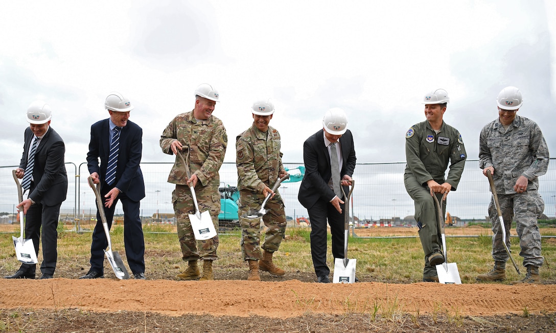 General Jeffrey L. Harrigian, U.S. Air Forces in Europe and Air Forces Africa commander, (center), poses for a photo with 48th Fighter Wing personnel and local civic leaders, partners and contractors during an F-35 groundbreaking ceremony at RAF Lakenheath, England, July 15, 2019. The groundbreaking follows the ongoing construction projects that will facilitate two F-35A Lighting II squadrons, making RAF Lakenheath the first permanent international site for U.S. fifth generation aircraft in Europe. (U.S. Air Force photo by Airman 1st Class Shanice Williams-Jones)