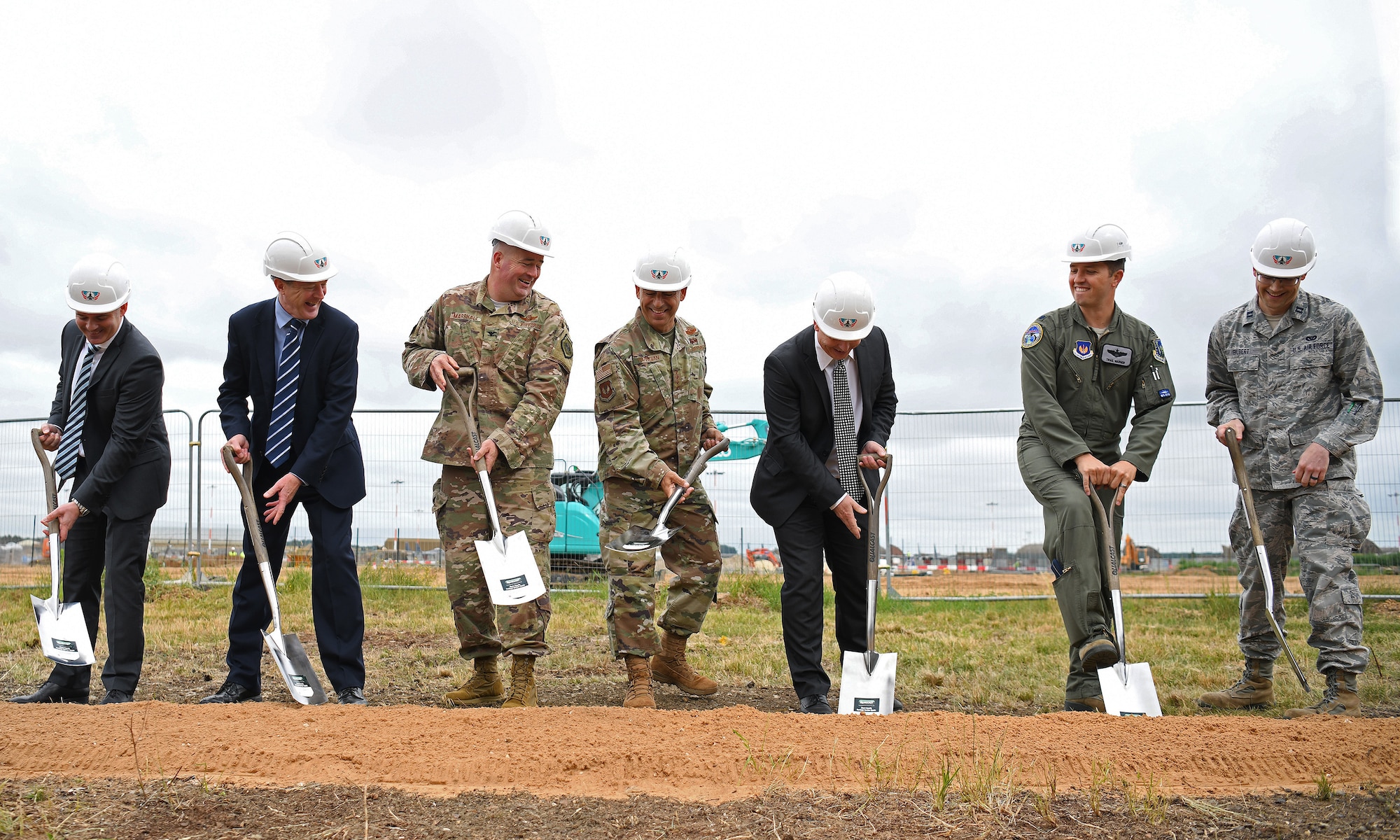 General Jeffrey L. Harrigian, U.S. Air Forces in Europe and Air Forces Africa commander, (center), poses for a photo with 48th Fighter Wing personnel and local civic leaders, partners and contractors during an F-35 groundbreaking ceremony at RAF Lakenheath, England, July 15, 2019. The groundbreaking follows the ongoing construction projects that will facilitate two F-35A Lighting II squadrons, making RAF Lakenheath the first permanent international site for U.S. fifth generation aircraft in Europe. (U.S. Air Force photo by Airman 1st Class Shanice Williams-Jones)