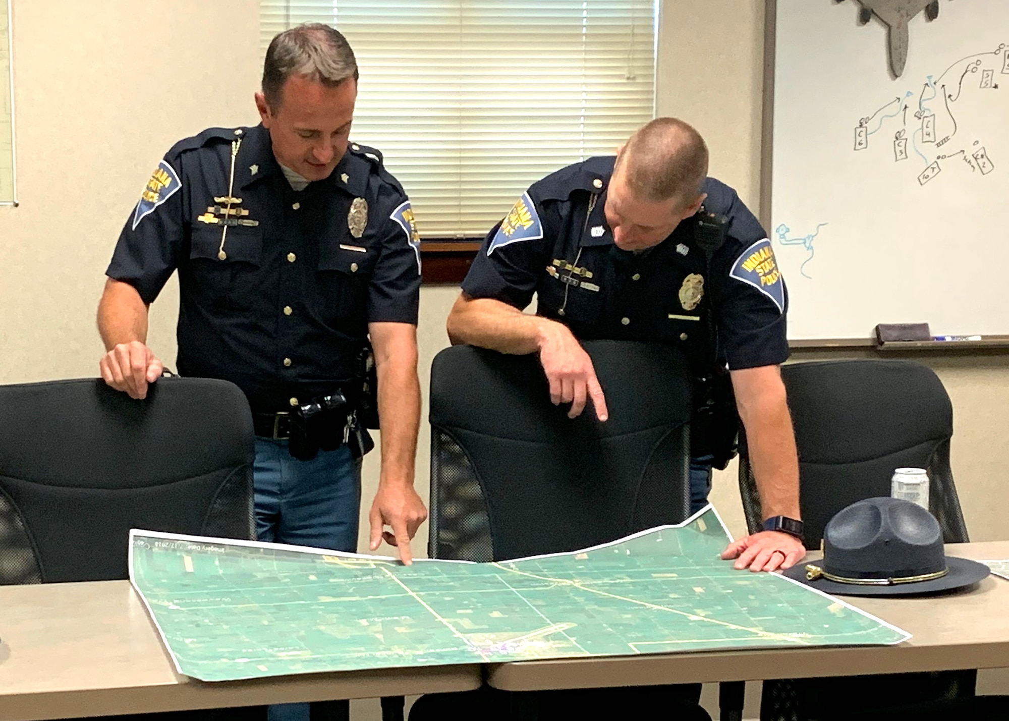 Troopers with the Indiana State Police review a parking map on June 9, 2019 at Grissom Air Reserve Base, Ind. The troopers have worked with base officials on parking plans for the Grissom Air and Space Expo scheduled for Sept. 7-8.
