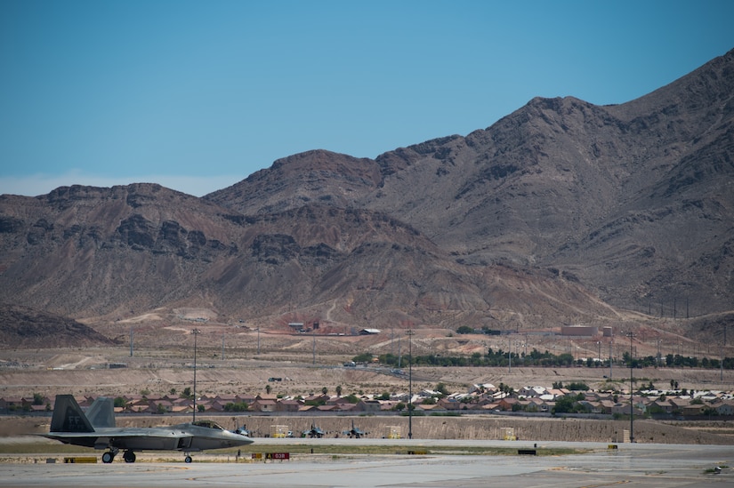 A U.S. Air Force F-22 Raptor from the 1st Fighter Wing lands at Nellis Air Force Base, Nevada, in support of Red Flag 19-3 July 11, 2019.