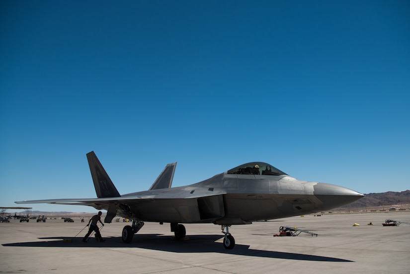 A U.S. Air Force F-22 Raptor from the 1st Fighter Wing lands at Nellis Air Force Base, Nevada, in support of Red Flag 19-3 July 11, 2019.