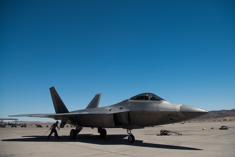 A U.S. Air Force F-22 Raptor from the 1st Fighter Wing lands at Nellis Air Force Base, Nevada, in support of Red Flag 19-3 July 11, 2019.