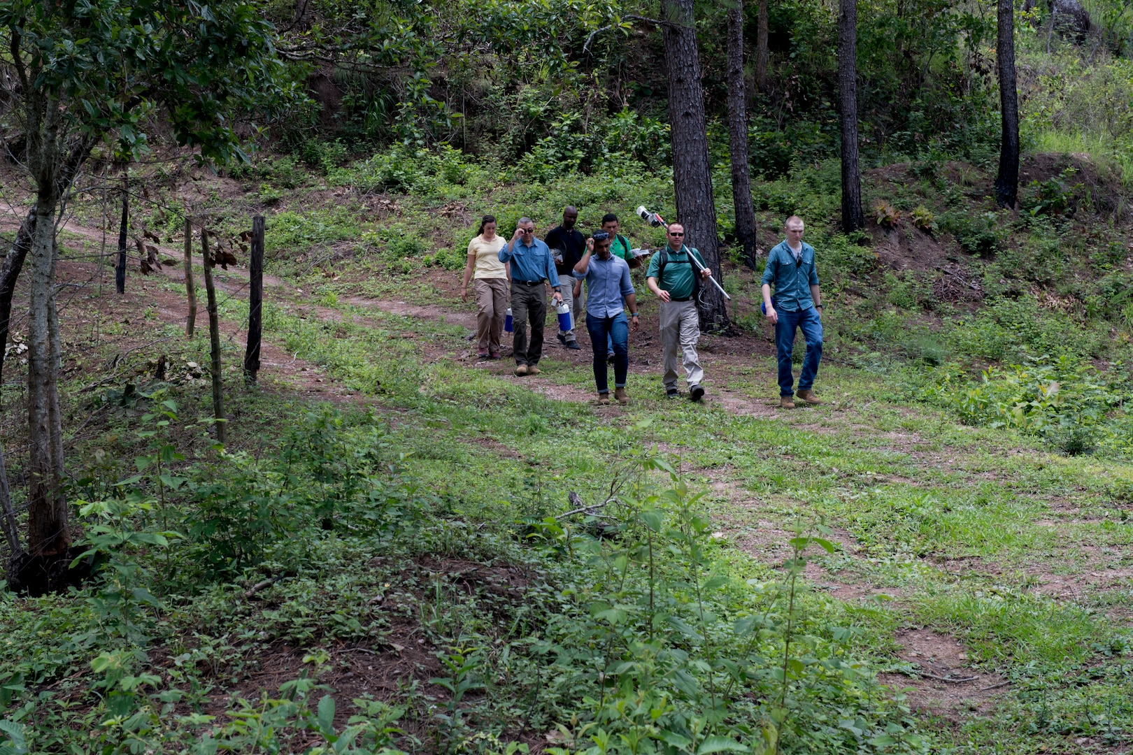 U.S. Army medical personnel traverse through mountains to visit homes of possible Leishamaniasis patients during an investigation July 9, 2019, at La Libertad, Honduras. Members of JTF-B were asked by the Honduran Ministry of Health to conduct an investigation into the cause of Leishmaniasis and provide any recommendations that may stop infection. Leishmaniasis is a parasitic disease that is caused by infection with leishmania parasites, which are spread through the bite of sand flies. (U.S. Air Force photo by Staff Sgt. Eric Summers Jr.)