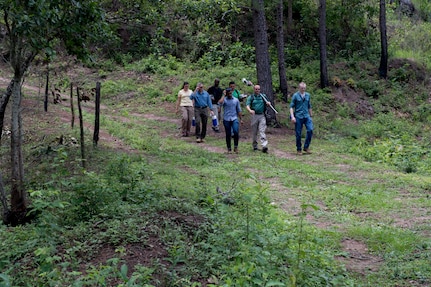 U.S. Army medical personnel traverse through mountains to visit homes of possible Leishamaniasis patients during an investigation July 9, 2019, at La Libertad, Honduras. Members of JTF-B were asked by the Honduran Ministry of Health to conduct an investigation into the cause of Leishmaniasis and provide any recommendations that may stop infection. Leishmaniasis is a parasitic disease that is caused by infection with leishmania parasites, which are spread through the bite of sand flies. (U.S. Air Force photo by Staff Sgt. Eric Summers Jr.)