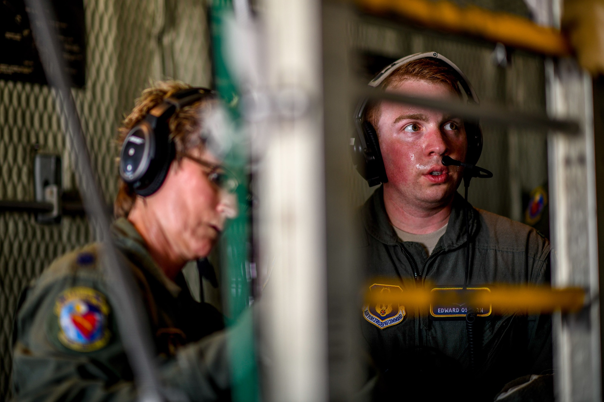 1st Lt. Edward Osborn, a Reserve Citizen Airman with the 445th Aeromedical Evacuation Squadron, communicates with medical personnel aboard a Youngstown Air Reserve Station C-130H Hercules on July 10, 2019, on the flightline at Wright-Patterson Air Force Base.