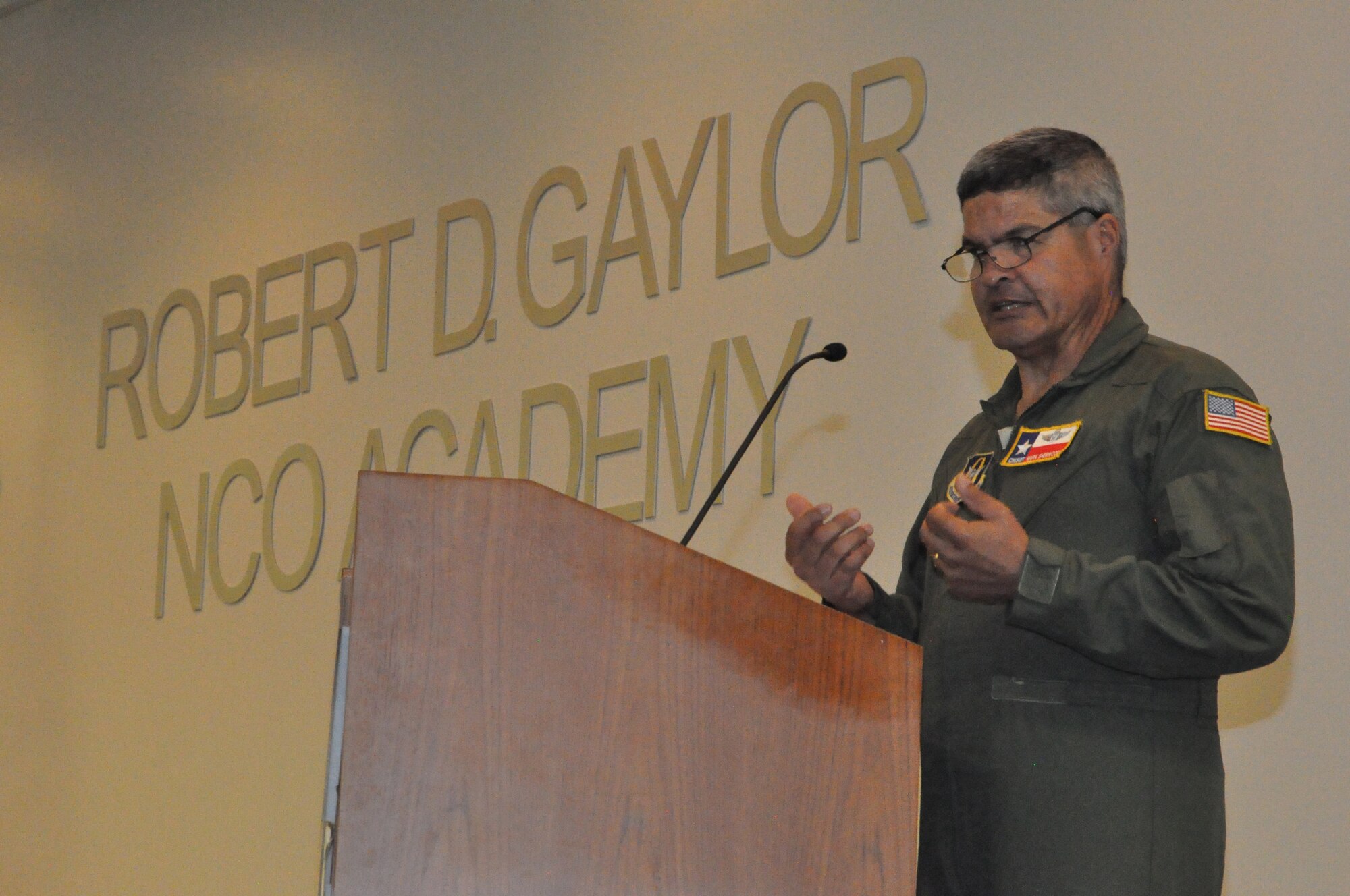 Chief Master Sgt. Mark Sherwood, 356th Airlift Squadron, speaks at the noncommissioned officer induction ceremony held July 13, 2019 at the Robert D. Gaylor NCO Academy, Joint Base San Antonio-Lackland, Texas.