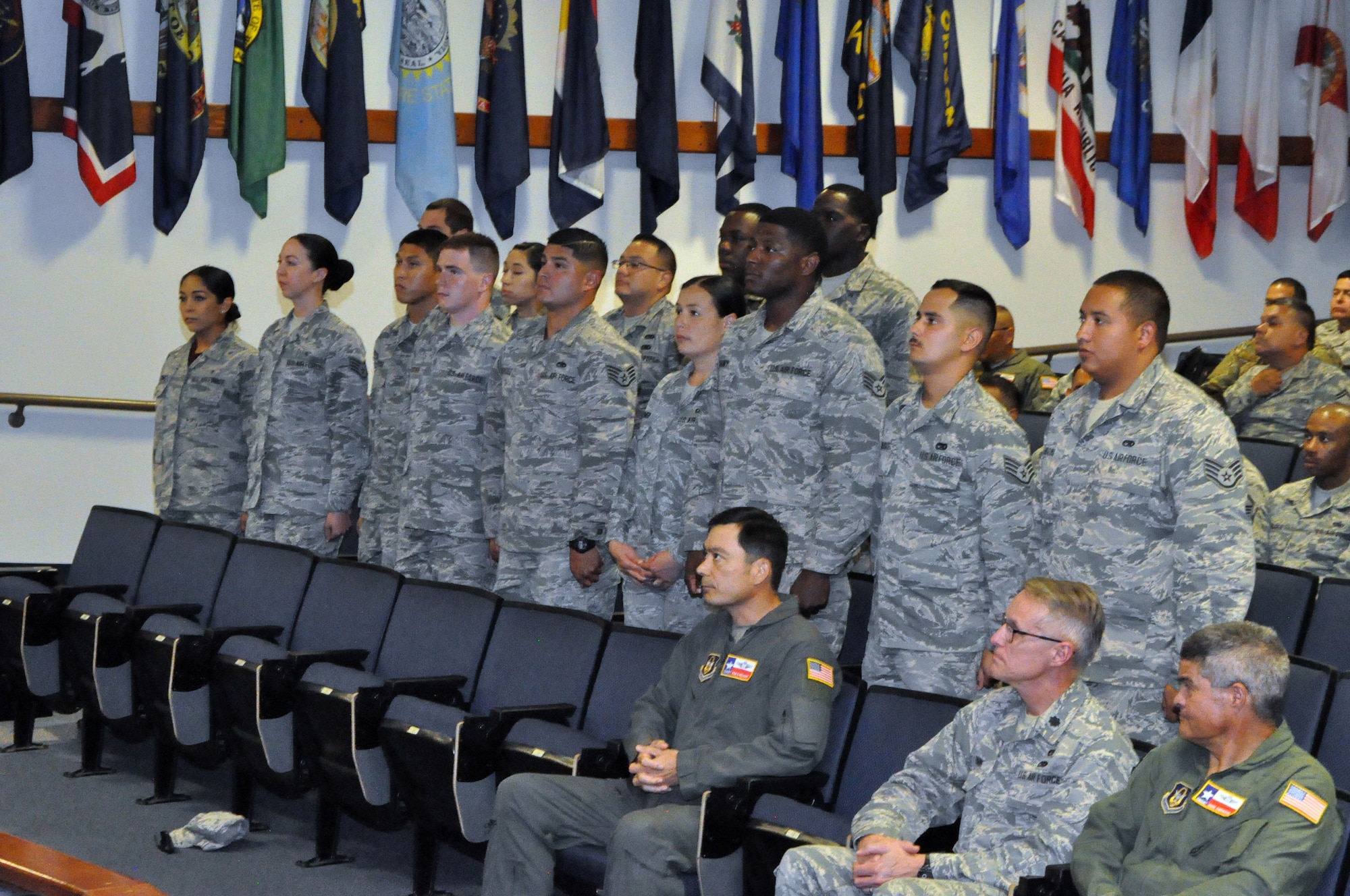 Reserve Citizen Airmen stand as they are recognized during an induction ceremony before reciting the oath of the noncommissioned officer July 13, 2019 at the Robert D. Gaylor NCO Academy, Joint Base San Antonio-Lackland, Texas.
