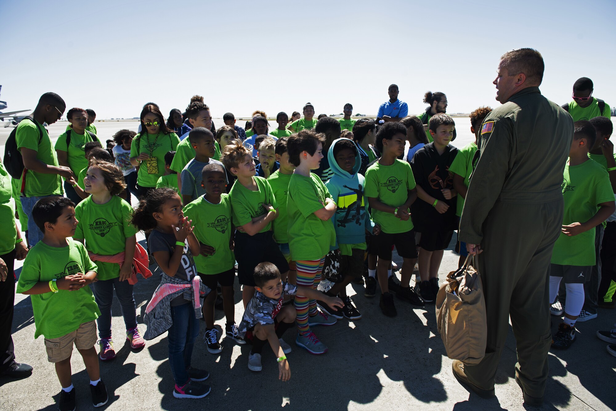 U.S. Air Force Tech. Sgt. Ryan Padgett, 22nd Airlift Squadron unit technician, briefs children from the Suisun City Salvation Army Kroc Center summer camp students July 11, 2019, at Travis Air Force Base, California. This tour gave members of the local community the chance to see what Airmen assigned to the 22nd AS do on a daily basis. (U.S. Air Force photo by Senior Airman Jonathon Carnell)