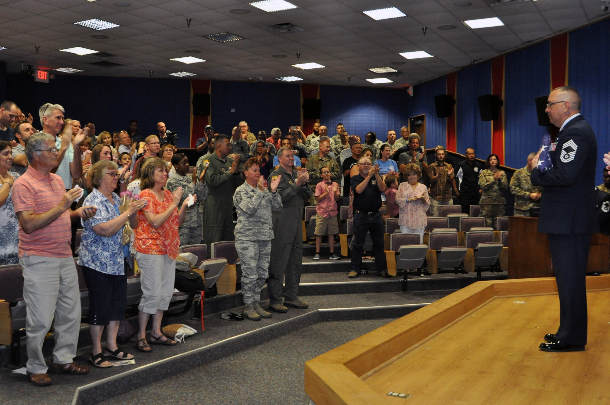 Chief Master Sgt. Joseph Salomon, 433rd Maintenance Group superintendent, receives a standing ovation during his retirement ceremony July 13, 2019 at Joint Base San Antonio-Lackland, Texas.