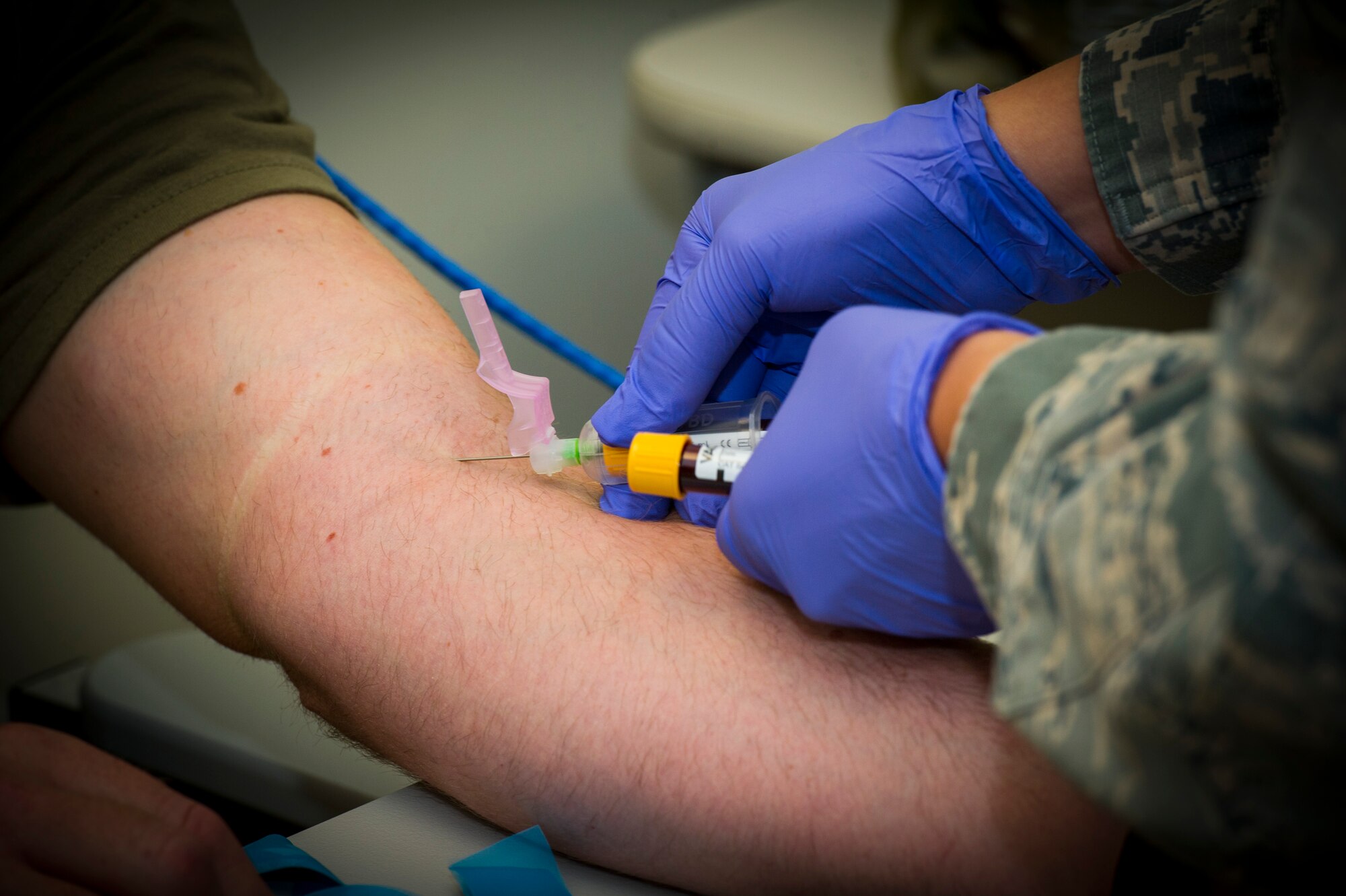 U.S. Air Force Tech Sgt. Leslie Robinson, 926th Aerospace Medicine Squadron medical lab technician, draws blood from a patient inside the medical clinic, July 13, 2019 at Nellis Air Force Base, Nev.