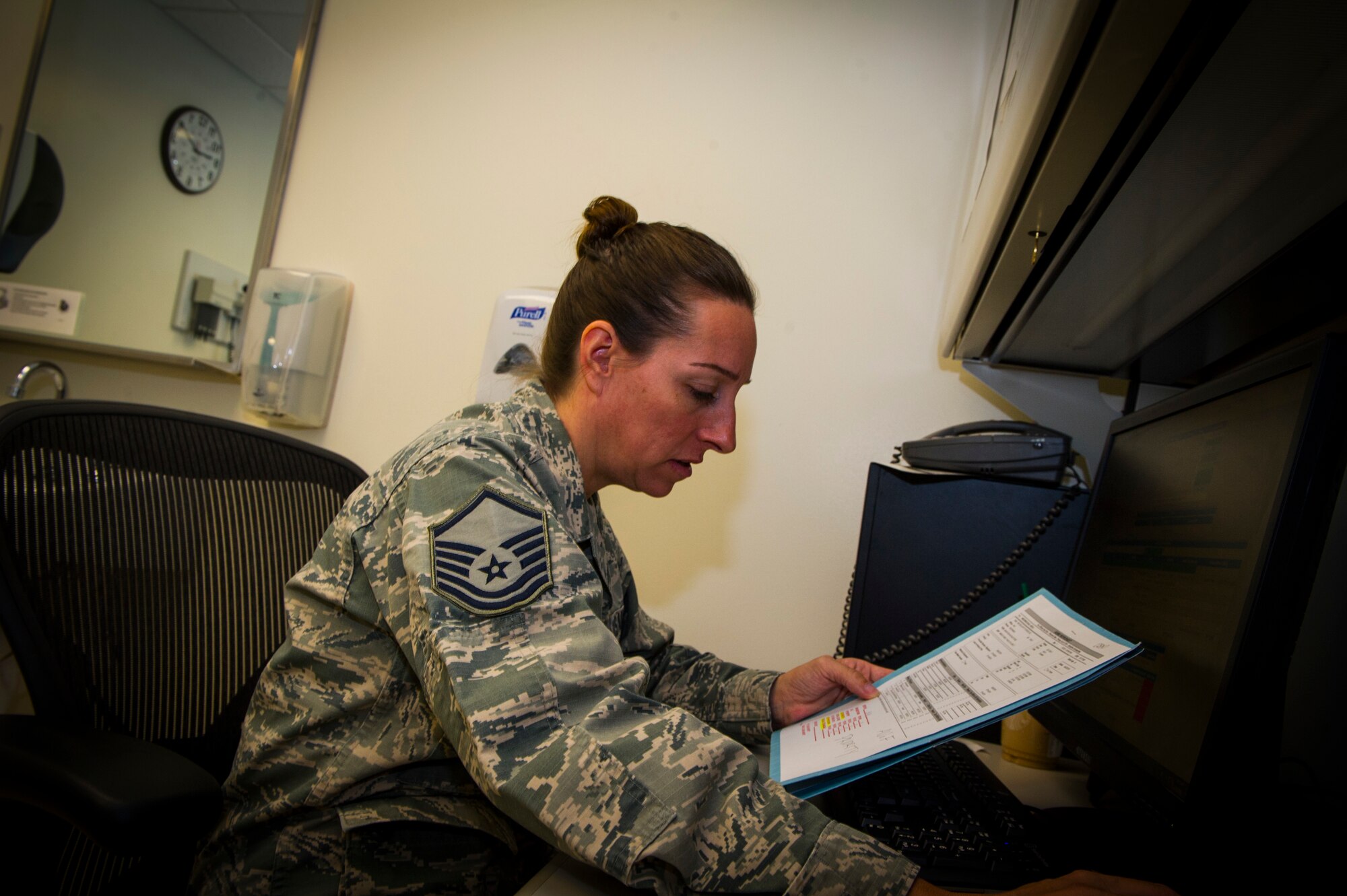 U.S. Air Force Master Sgt. Chrystal Myers, 926th Aerospace Medicine Squadron medical technician, reviews medical records for a patient inside the medical clinic, July 13, 2019 at Nellis Air Force Base, Nev. The 926 AMDS provides direct medical support to Reserve Airmen to maintain operational readiness. (U.S. Air Force photo/Senior Airman Brett Clashman)