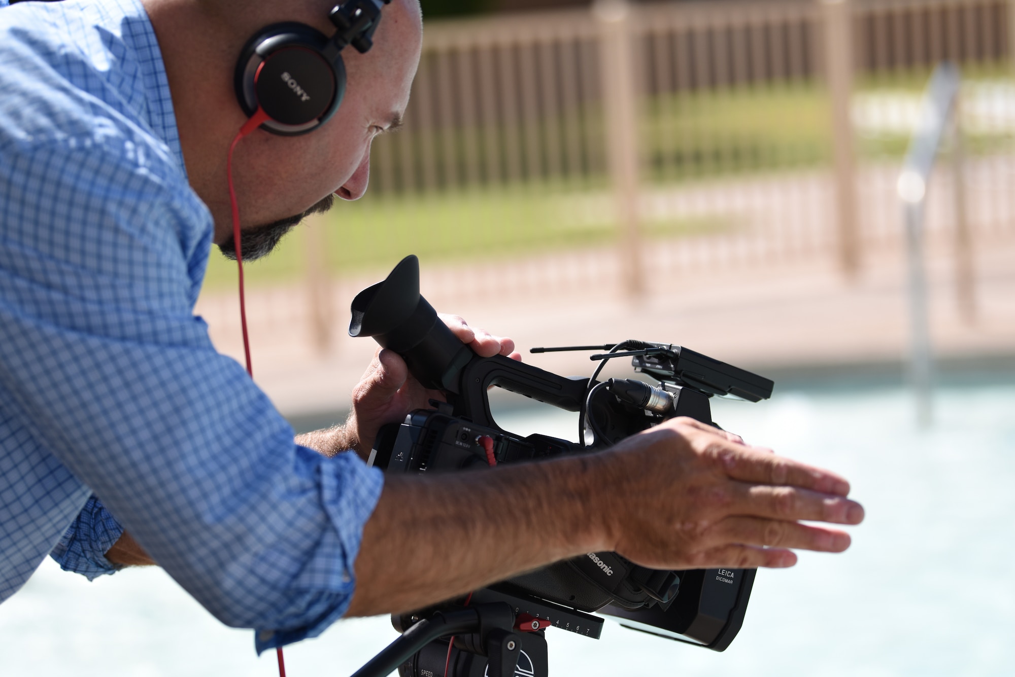 Keith Wright, Air Force Safety Center Public Affairs deputy chief, films a public service announcement on riptides at Kirtland Air Force Base, N.M., July 11, 2019. The PSA will be shown on social media, the Armed Forces Network and online. (U.S. Air Force photo by Senior Airman Eli Chevalier)