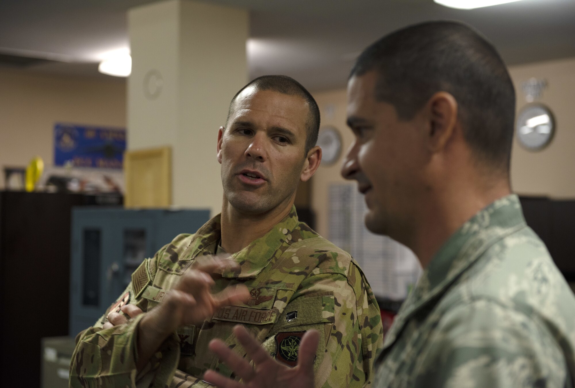 U.S. Air Force Col. Zachery Jiron, left, 60th Air Mobility Wing vice commander, talks with Tech. Sgt. Jason Lares, 60th Logistics Ready Squadron NCO in charge of decentralized materiel support, July 12, 2019, at Travis Air Force Base, California. Jiron went to the LRS for Leadership Rounds, a program that allows wing leadership to get a detailed view of their mission at Travis Air Force Base. (U.S. Air Force photo by Senior Airman Jonathon Carnell)