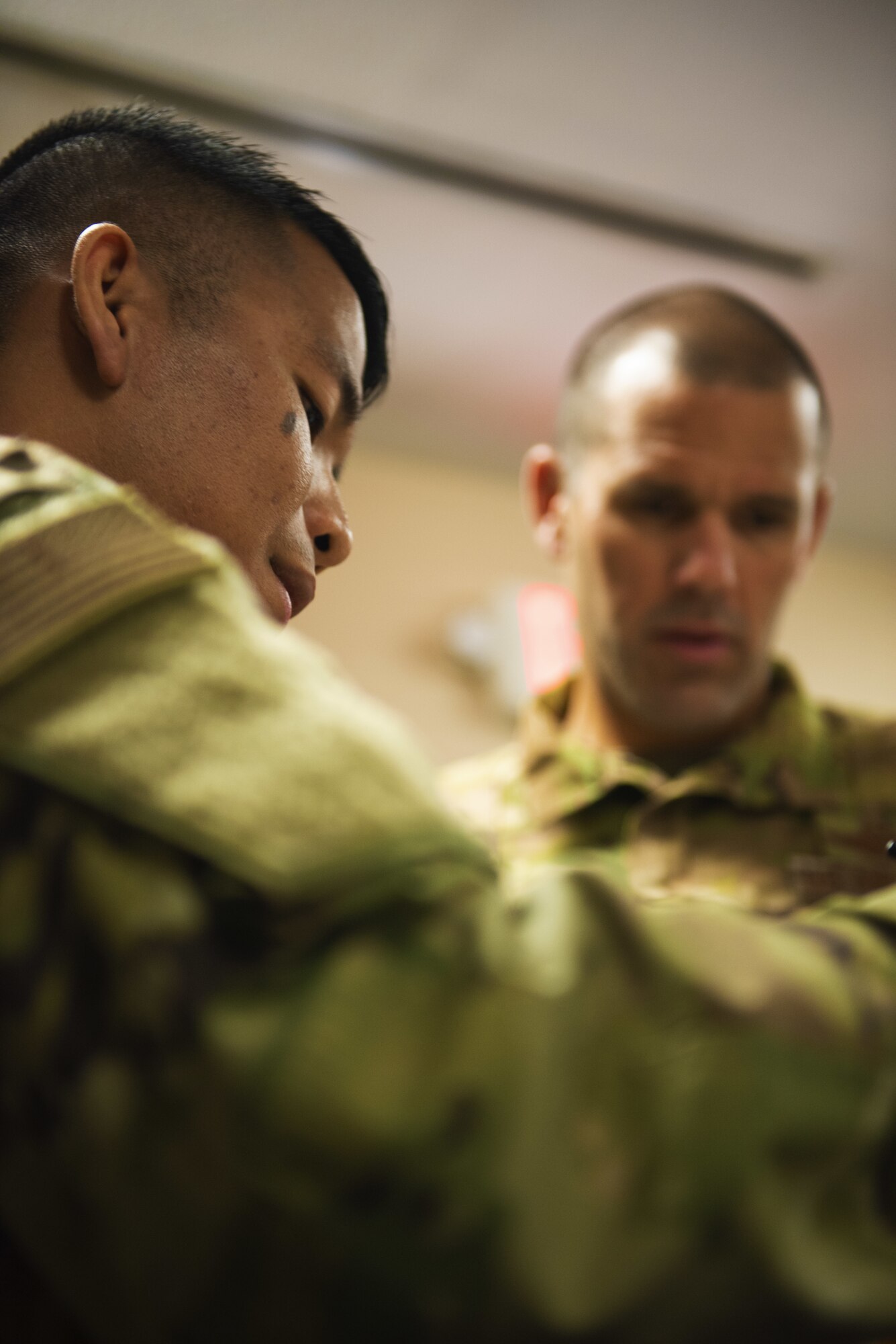 U.S. Air Force Senior Airman Jerome Macalino, left, 60th Logistics Readiness Squadron service center journeyman and a star performer, speaks about his job to Col. Zachery Jiron, 60th Air Mobility Wing vice commander, July 12, 2019, at Travis Air Force Base, California. Jiron went to the LRS for Leadership Rounds, a program that allows wing leadership to get a detailed view of their mission at Travis Air Force Base. (U.S. Air Force photo by Senior Airman Jonathon Carnell)