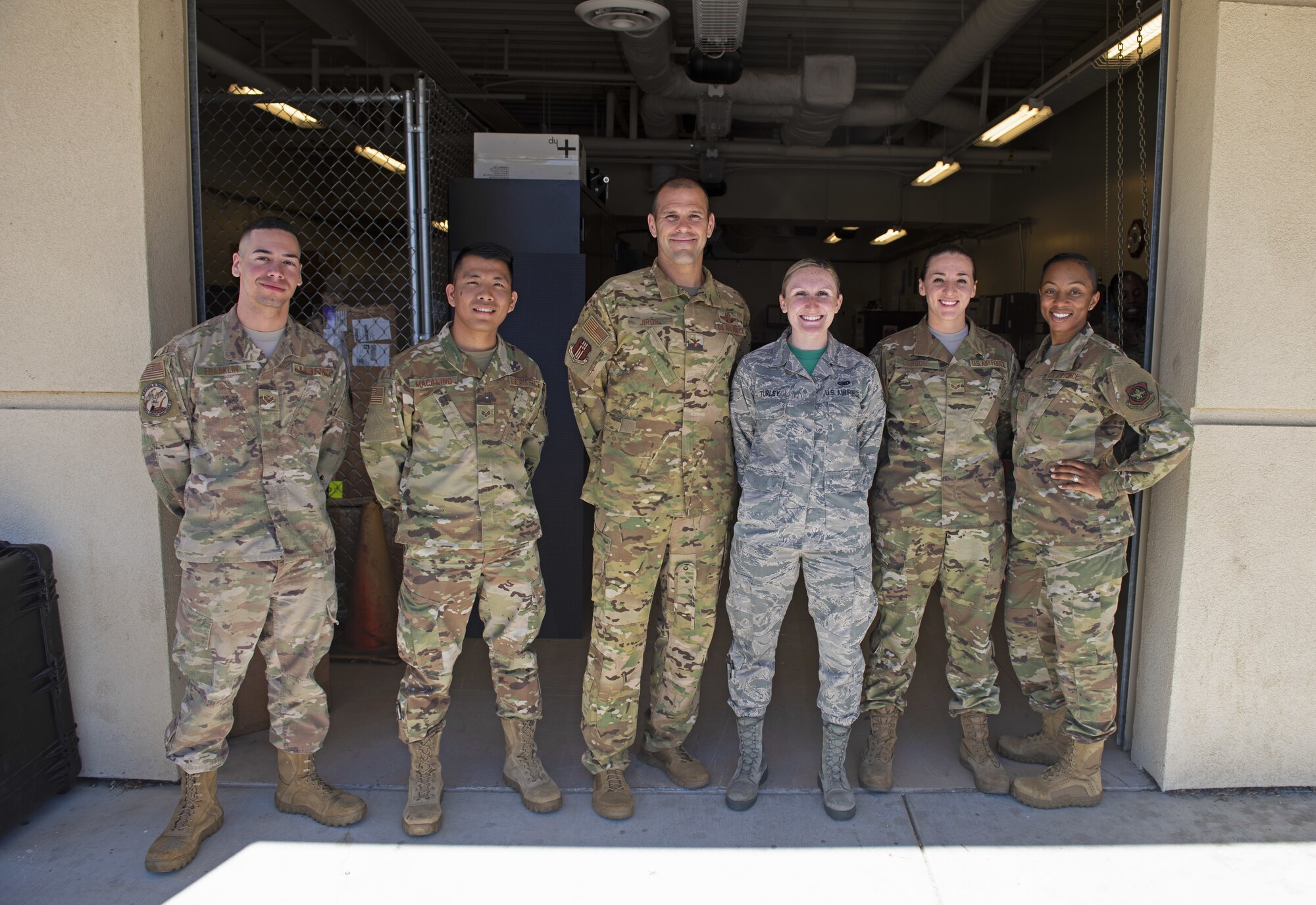 U.S. Air Force Airmen assigned to the 60th Logistics Readiness Squadron pose for a photo with Col. Zachery Jiron, 60th Air Mobility Wing vice commander, July 12, 2019, at Travis Air Force Base, California. Jiron went to the LRS for Leadership Rounds, a program that allows wing leadership to get a detailed view of their mission at Travis Air Force Base. (U.S. Air Force photo by Senior Airman Jonathon Carnell)
