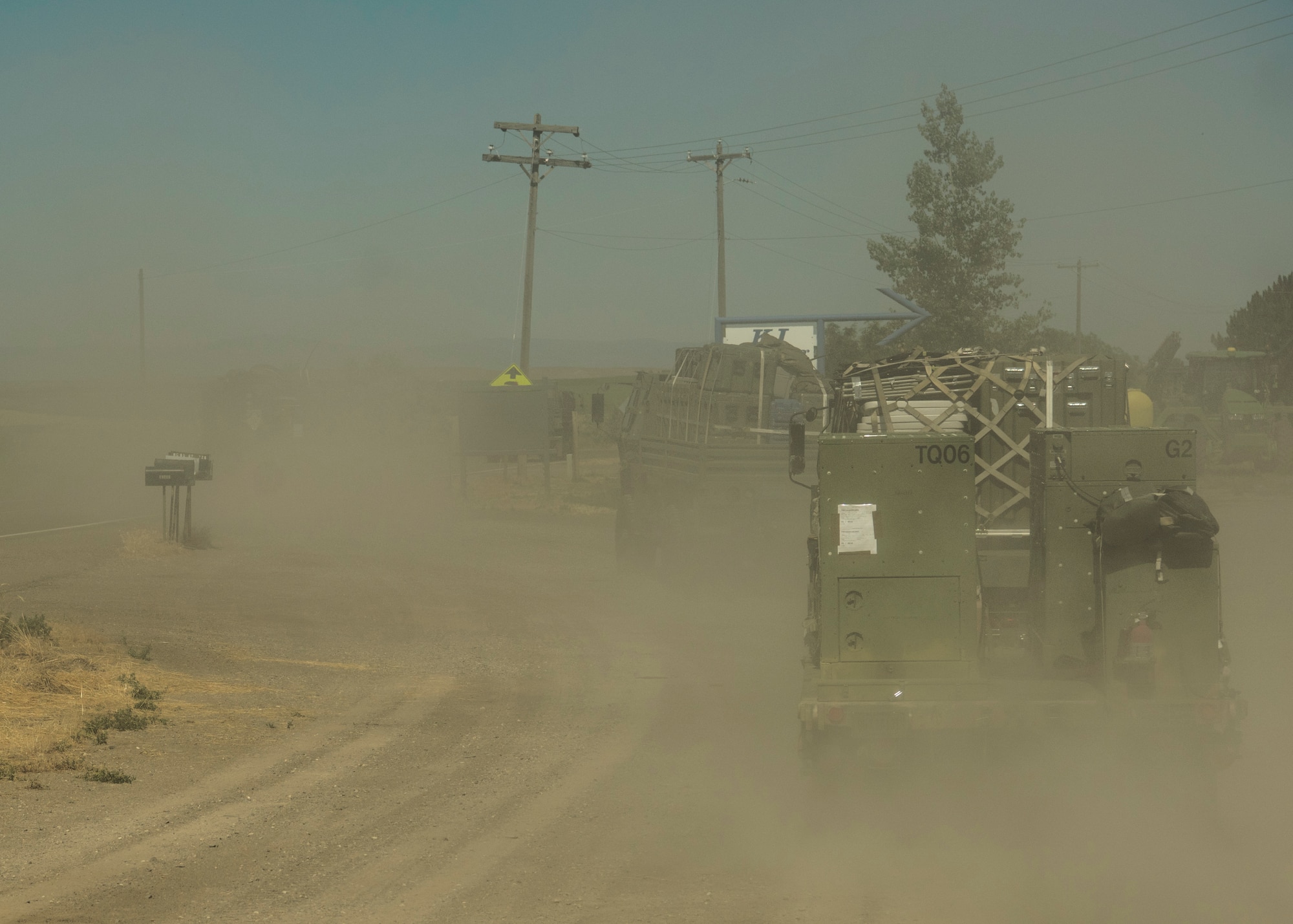 A U.S. Air Force convoy of 5-ton trucks from the 726th Air Control Squadron transports a variety of equipment July 14, 2019, near Mountain Home Air Force Base, Idaho. This convoy was in support of Hardrock Exercise 19-2, where supplies on the truck enabled the 726th ACS Airmen to set up an entirely self-sufficient base in a simulated remote location. (U.S. Air Force photo by Airman 1st Class Andrew Kobialka)