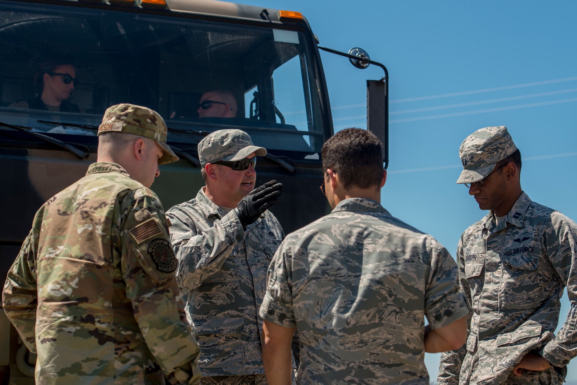 Tech. Sgt. Joshua Kelly, 726th Air Control Squadron NCO in charge of power production, briefs the Mobile Operating Air Base (MOAB) setup to other U.S. Air Force Airmen July 14, 2019, at Mountain Home Air Force Base, Idaho. This convoy was in support of Hardrock Exercise 19-2, where supplies on the truck enabled the 726th ACS Airmen to set up an entirely self-sufficient base in a simulated remote location. (U.S. Air Force photo by Senior Airman JaNae Capuno)