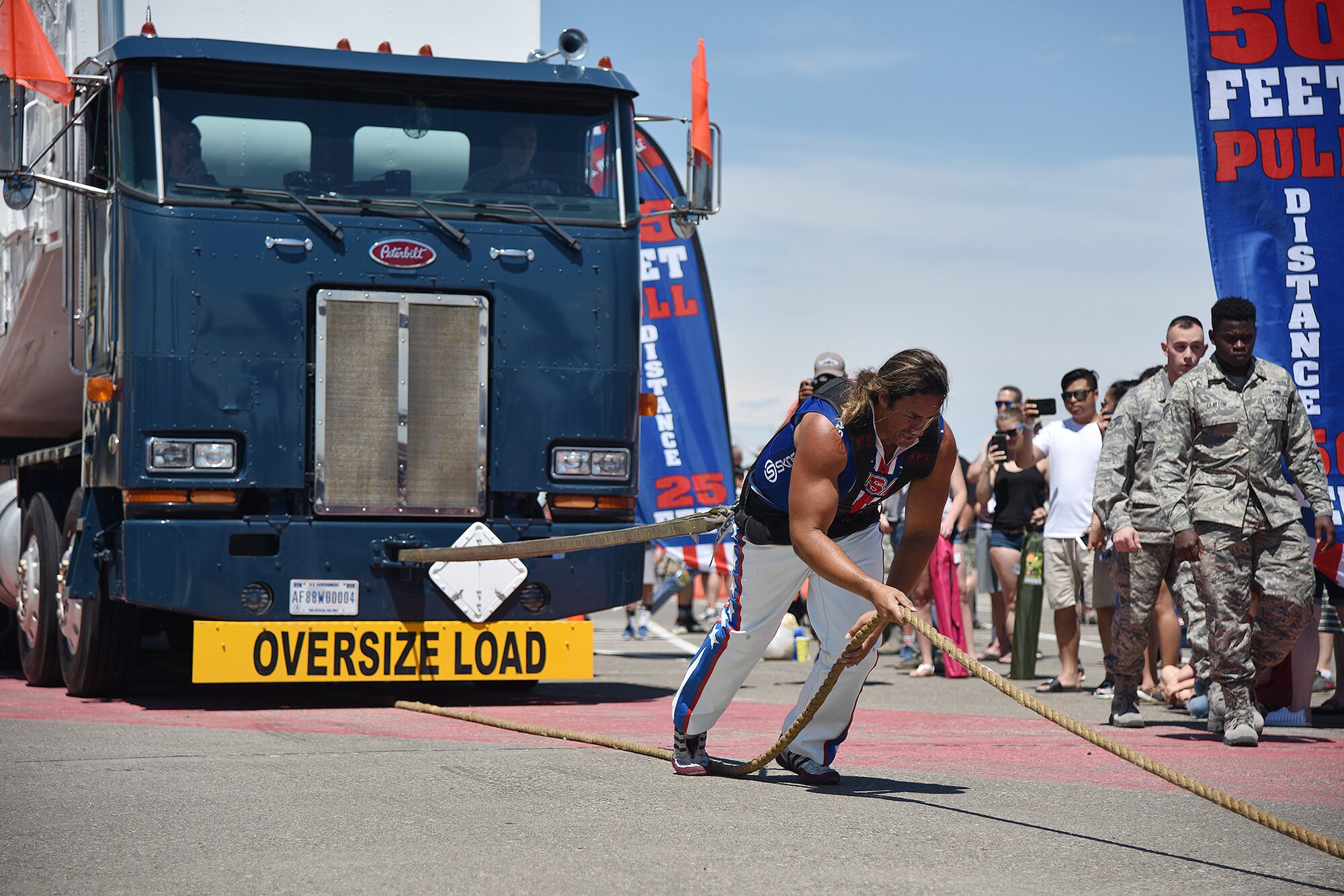 Mark Kirsch, strongman and entertainer, pulls a Transport Erector missile maintenance truck July 13, 2019, at the “Mission Over Malmstrom” open house event on Malmstrom Air Force Base, Mont.
