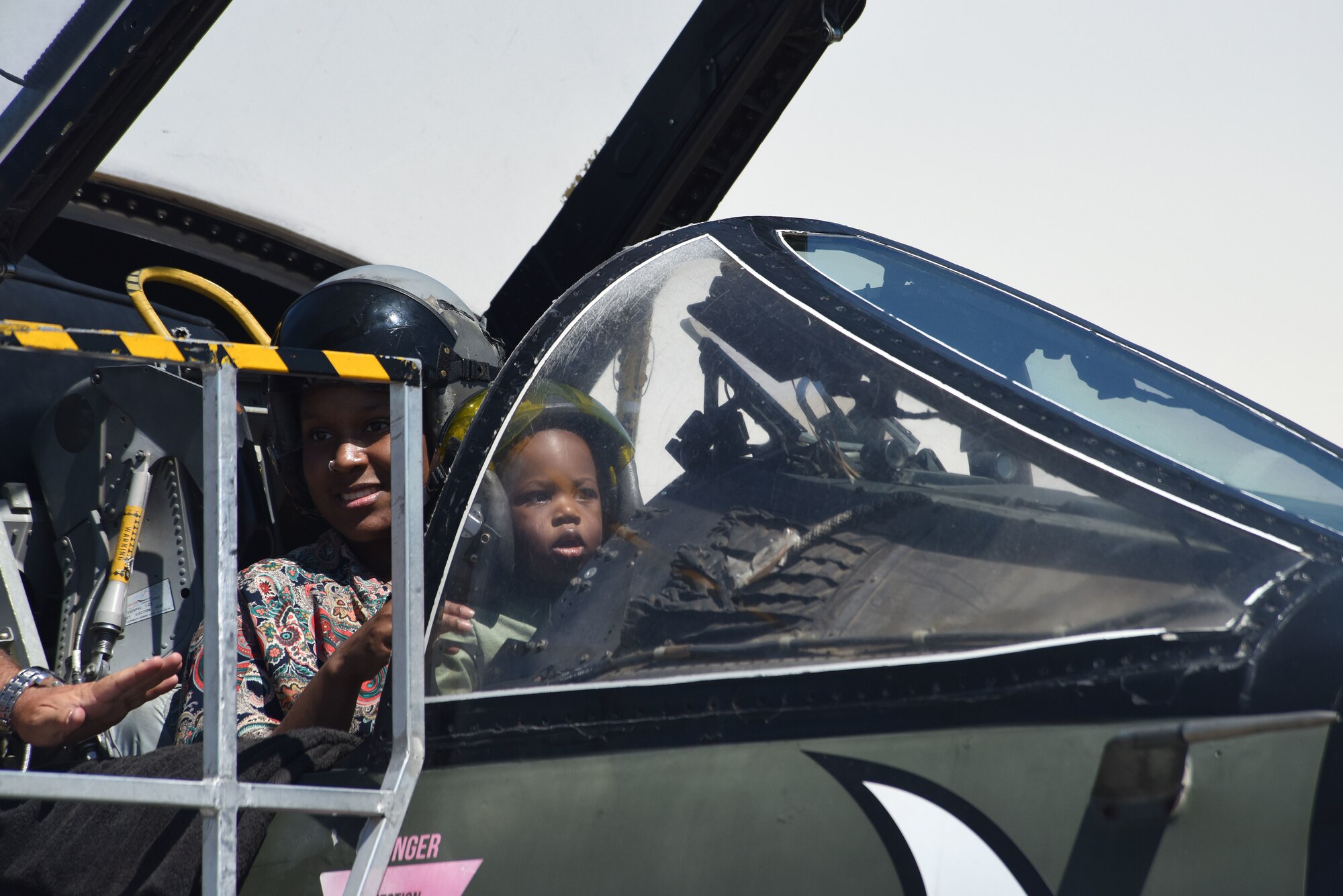 A family participates in a cockpit experience July 13, 2019, at the “Mission Over Malmstrom” open house event on Malmstrom Air Force Base, Mont.
