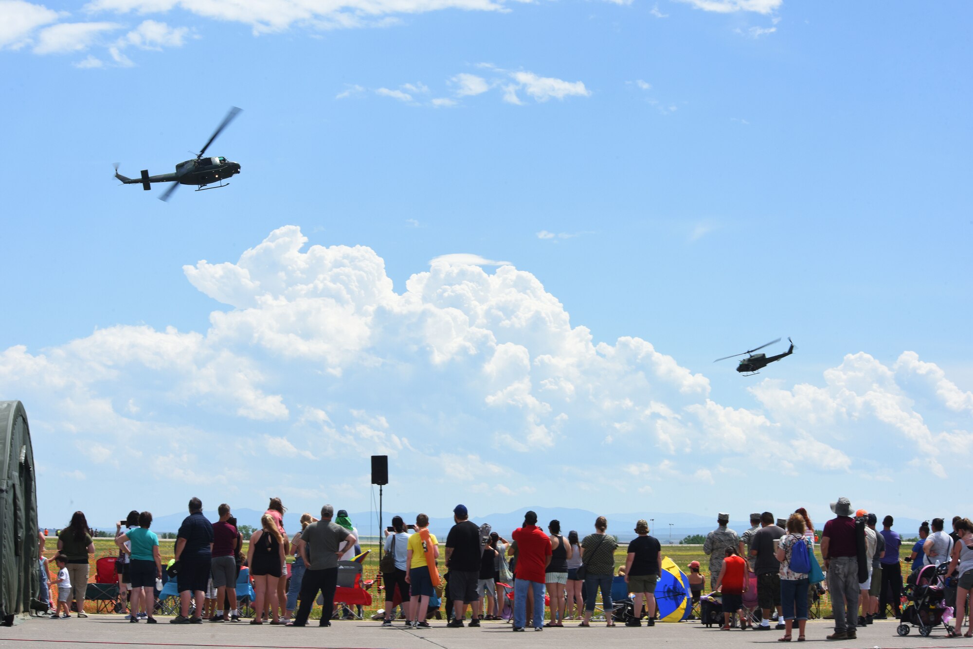 Two UH-1N helicopters with the 40th Helicopter Squadron perform flight maneuvers July 13, 2019, at the “Mission Over Malmstrom” open house event on Malmstrom Air Force Base, Mont.