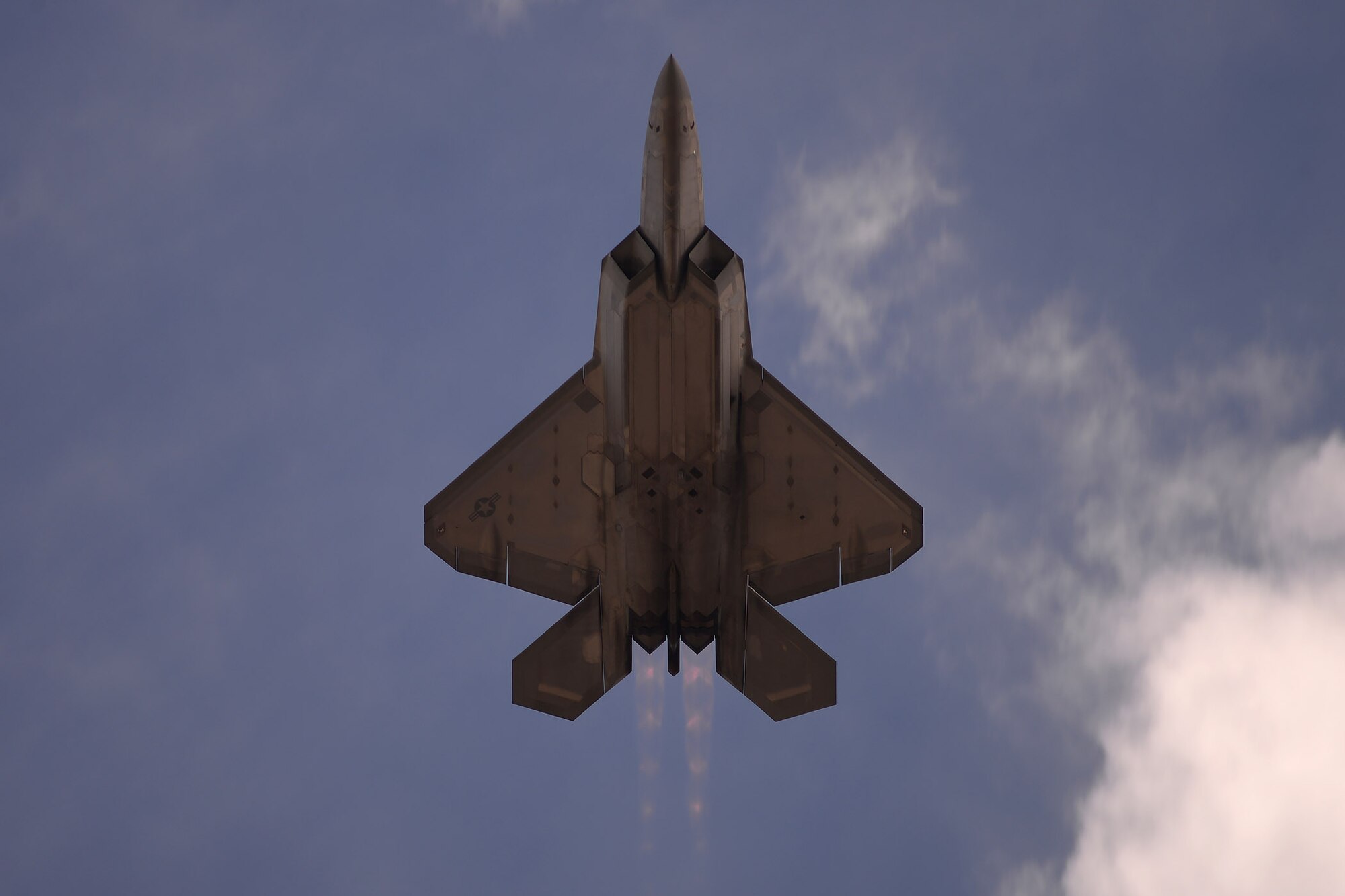 U.S. Air Force Maj. Paul Lopez, F-22 Demo Team commander, performers aerial maneuvers July 14, 2019, at the “Mission Over Malmstrom” open house event on Malmstrom Air Force Base, Mont.