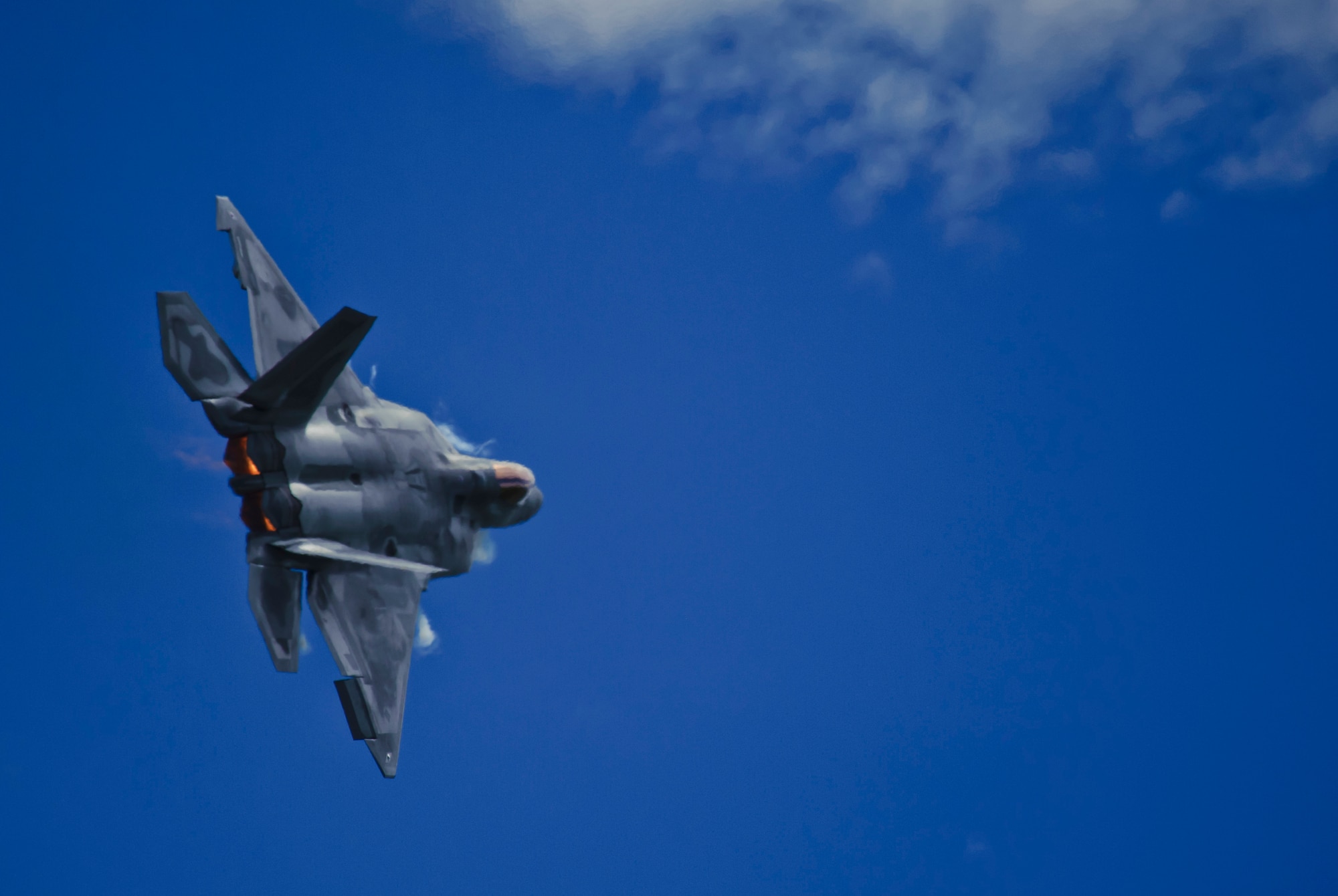 U.S. Air Force Maj. Paul Lopez, F-22 Demo Team commander, performers aerial maneuvers July 14, 2019, at the “Mission Over Malmstrom” open house event on Malmstrom Air Force Base, Mont